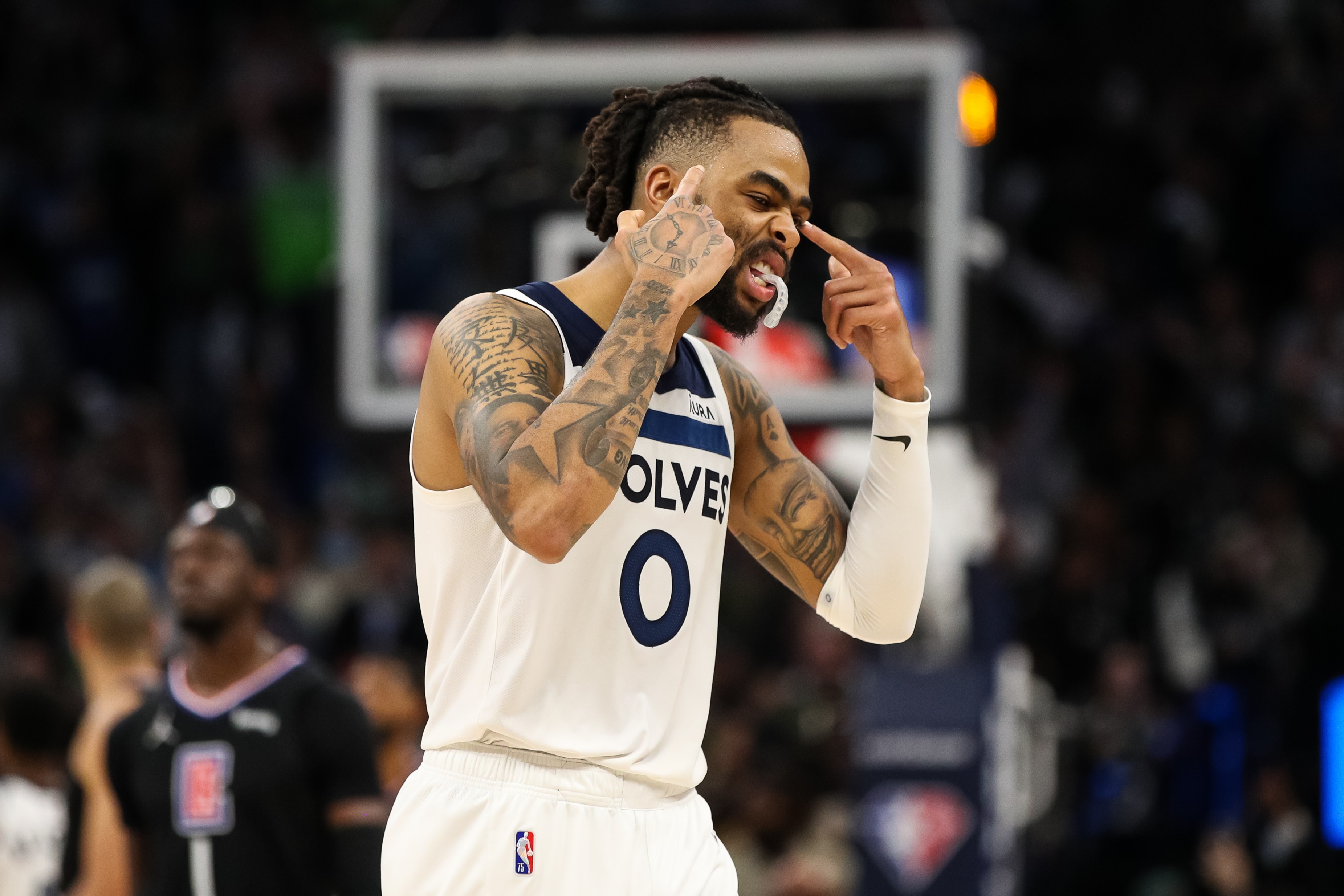 MINNEAPOLIS, MN - APRIL 12: D'Angelo Russell #0 of the Minnesota Timberwolves celebrates as time expires against the Los Angeles Clippers in the fourth quarter during a Play-In Tournament game at Target Center on April 12, 2022 in Minneapolis, Minnesota. The Timberwolves won 109-104 to advance to the NBA Playoffs. NOTE TO USER: User expressly acknowledges and agrees that, by downloading and or using this Photograph, user is consenting to the terms and conditions of the Getty Images License Agreement. (Photo by David Berding/Getty Images)