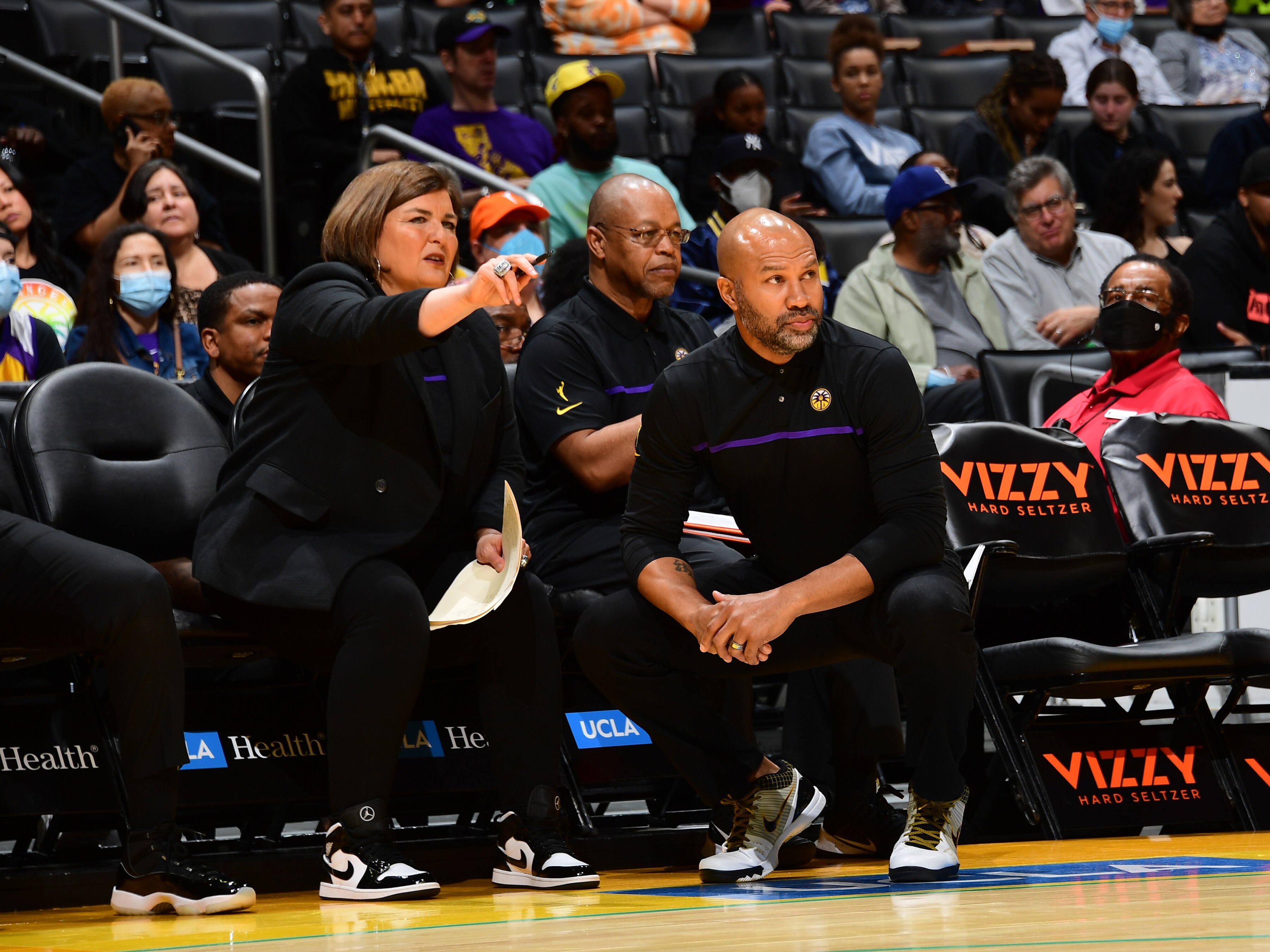 LOS ANGELES, CA - MAY 25: Assistant Coach Latricia Trammell confers with Head Coach Derek Fisher of the Los Angeles Sparks during the game against the Connecticut Sun on May 25, 2022 at Crypto.Com Arena in Los Angeles, California. NOTE TO USER: User expressly acknowledges and agrees that, by downloading and/or using this Photograph, user is consenting to the terms and conditions of the Getty Images License Agreement. Mandatory Copyright Notice: Copyright 2022 NBAE (Photo by Adam Pantozzi/NBAE via Getty Images)
