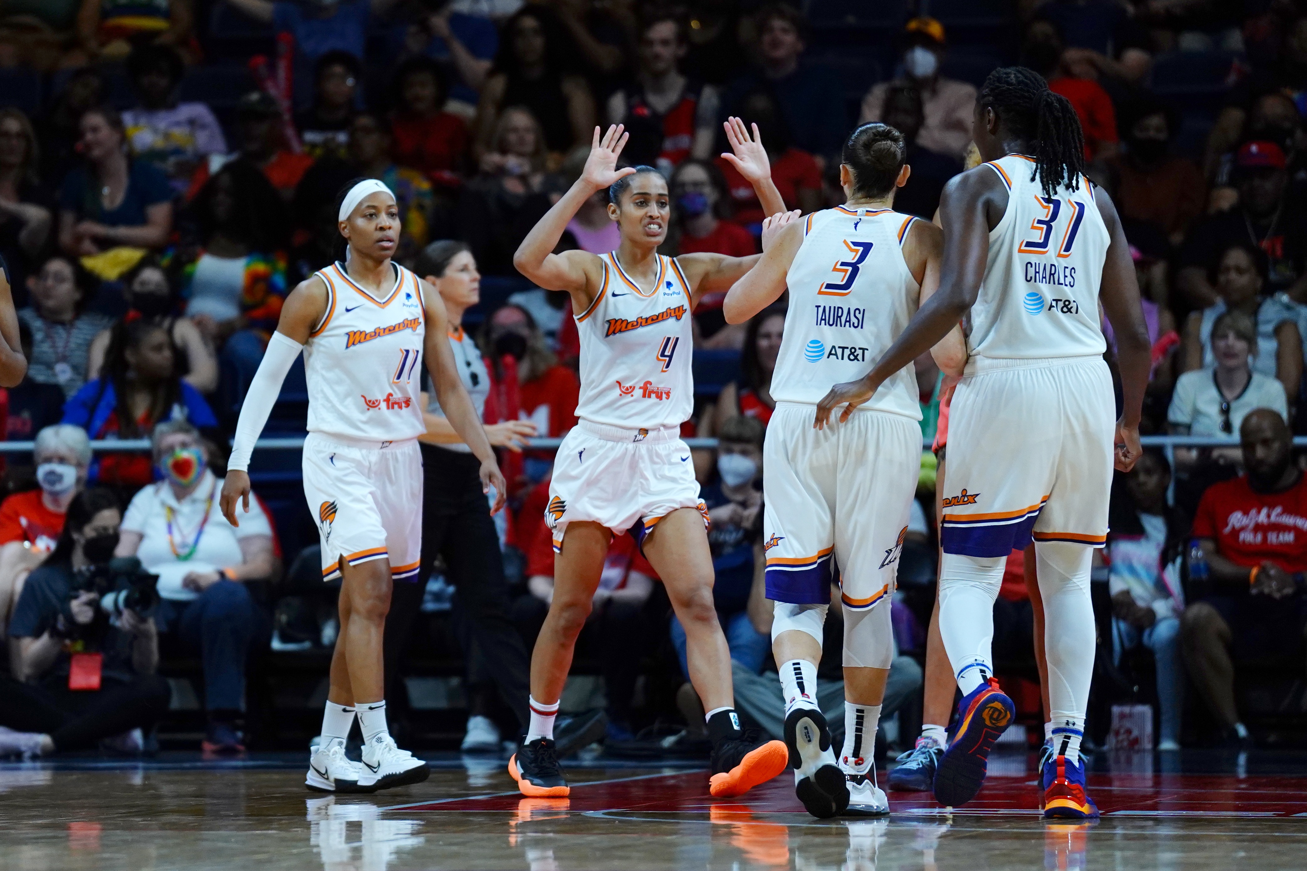 WASHINGTON, DC - JUNE 12: Skylar Diggins-Smith #4 of the Phoenix Mercury high fives Diana Taurasi #3 of the Phoenix Mercury during the game against the Washington Mystics on June 12, 2022 at Entertainment & Sports Arena in Washington, DC. NOTE TO USER: User expressly acknowledges and agrees that, by downloading and or using this Photograph, user is consenting to the terms and conditions of the Getty Images License Agreement. Mandatory Copyright Notice: Copyright 2022 NBAE (Photo by Mary Kate Ridgway/NBAE via Getty Images)