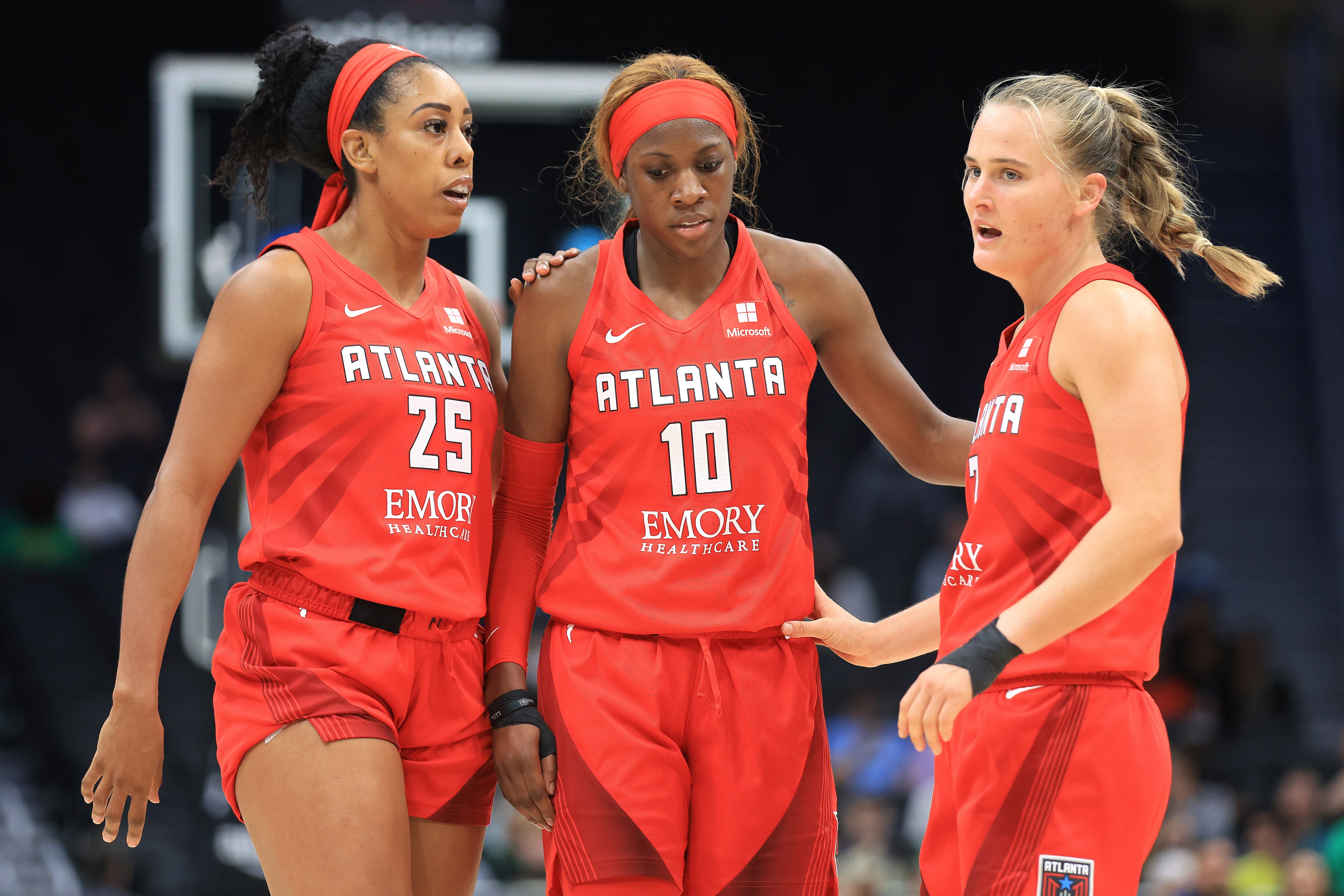 SEATTLE, WASHINGTON - JUNE 07: Monique Billings #25, Rhyne Howard #10 and Kristy Wallace #3 of the Atlanta Dream react during the third quarter against the Seattle Storm at Climate Pledge Arena on June 07, 2022 in Seattle, Washington. NOTE TO USER: User expressly acknowledges and agrees that, by downloading and or using this photograph, User is consenting to the terms and conditions of the Getty Images License Agreement. (Photo by Abbie Parr/Getty Images)