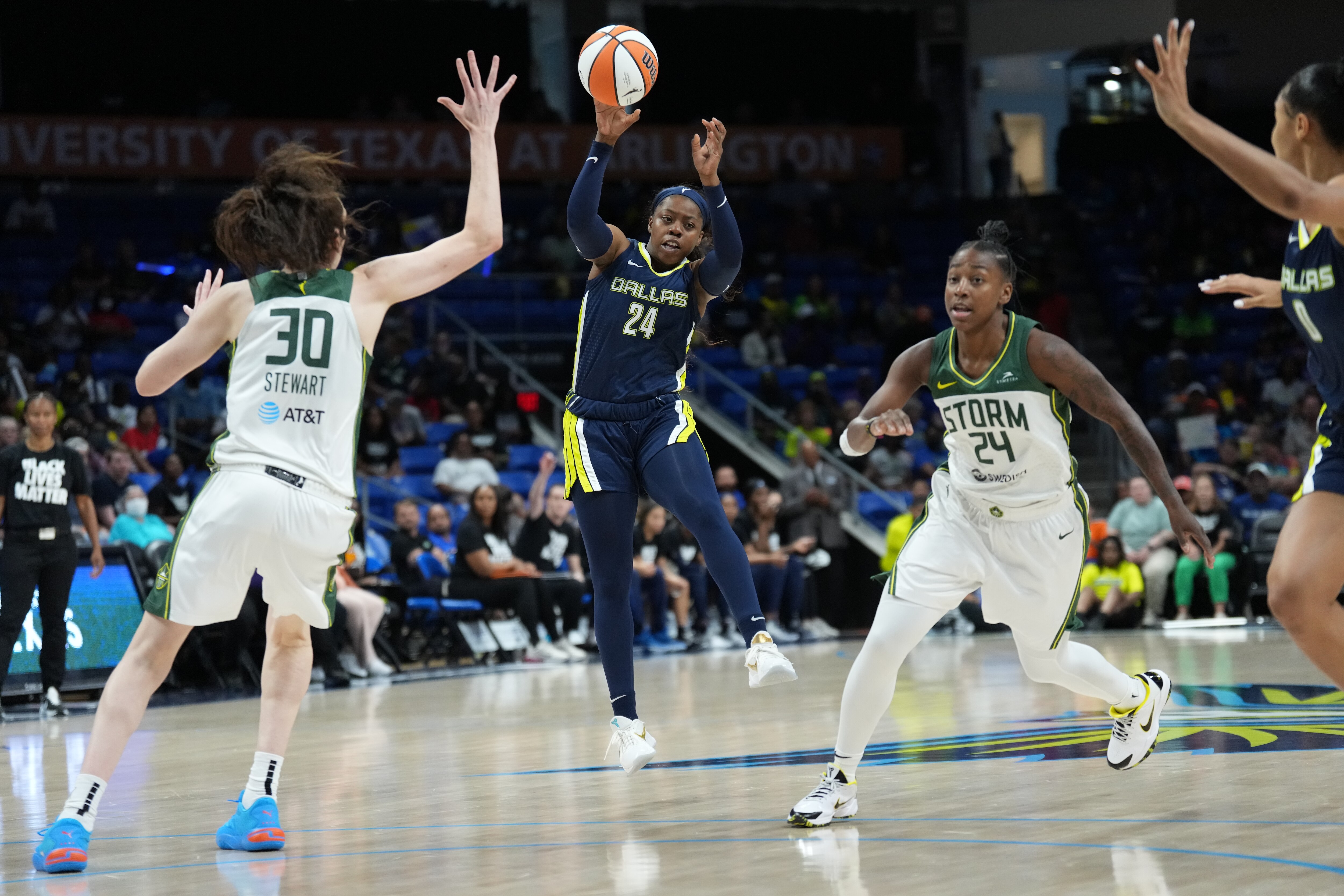 DALLAS, TX - JUNE 12: Arike Ogunbowale #24 of the Dallas Wings passes the ball during the game against the Seattle Storm on June 12, 2022 at the American Airlines Center in Dallas, Texas. NOTE TO USER: User expressly acknowledges and agrees that, by downloading and or using this photograph, User is consenting to the terms and conditions of the Getty Images License Agreement. Mandatory Copyright Notice: Copyright 2022 NBAE (Photo by Jim Cowsert/NBAE via Getty Images)