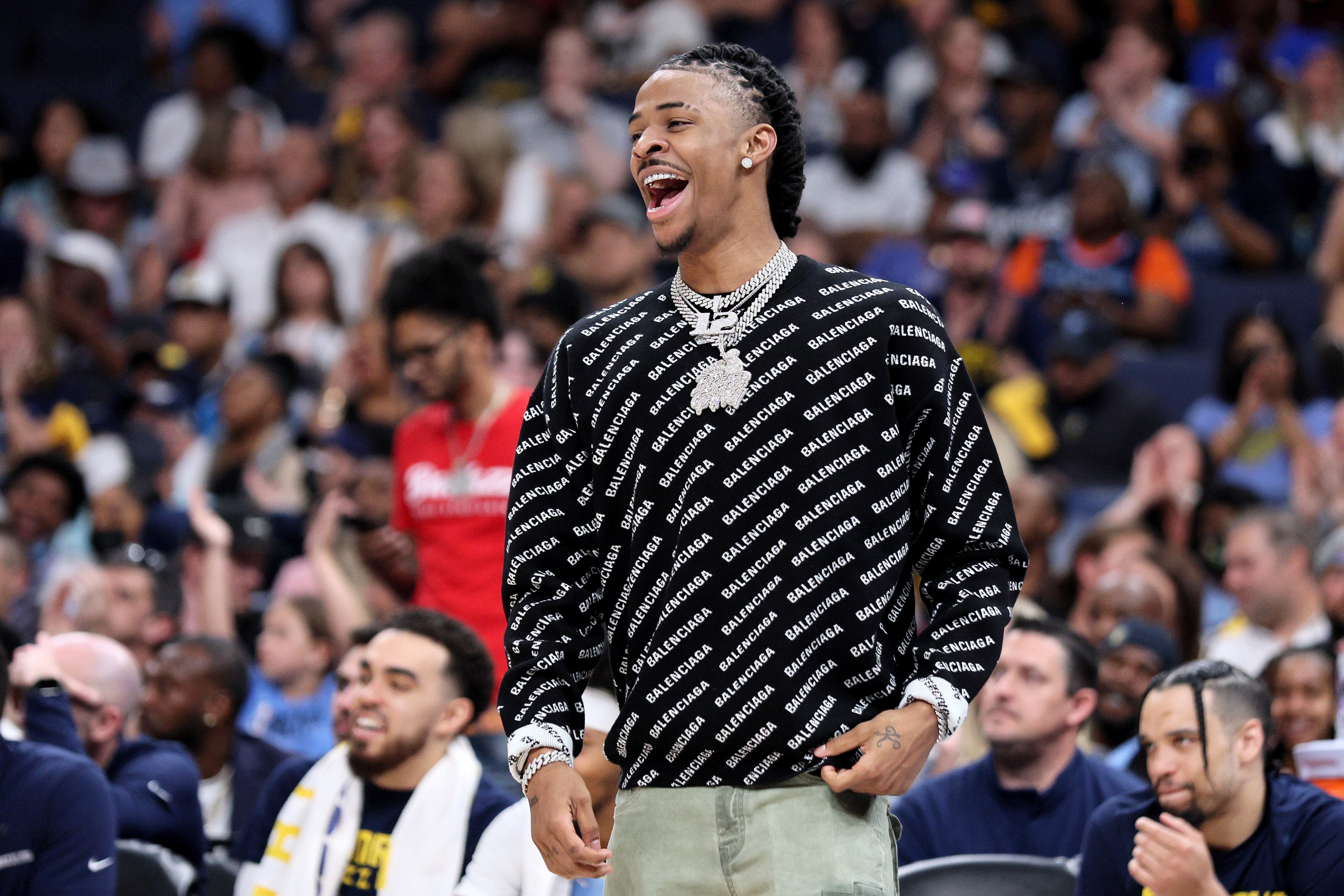 MEMPHIS, TENNESSEE - MAY 11: Ja Morant #12 of the Memphis Grizzlies reacts from the bench against the Golden State Warriors during the fourth quarter in Game Five of the 2022 NBA Playoffs Western Conference Semifinals at FedExForum on May 11, 2022 in Memphis, Tennessee. NOTE TO USER: User expressly acknowledges and agrees that, by downloading and/or using this photograph, User is consenting to the terms and conditions of the Getty Images License Agreement. (Photo by Andy Lyons/Getty Images)