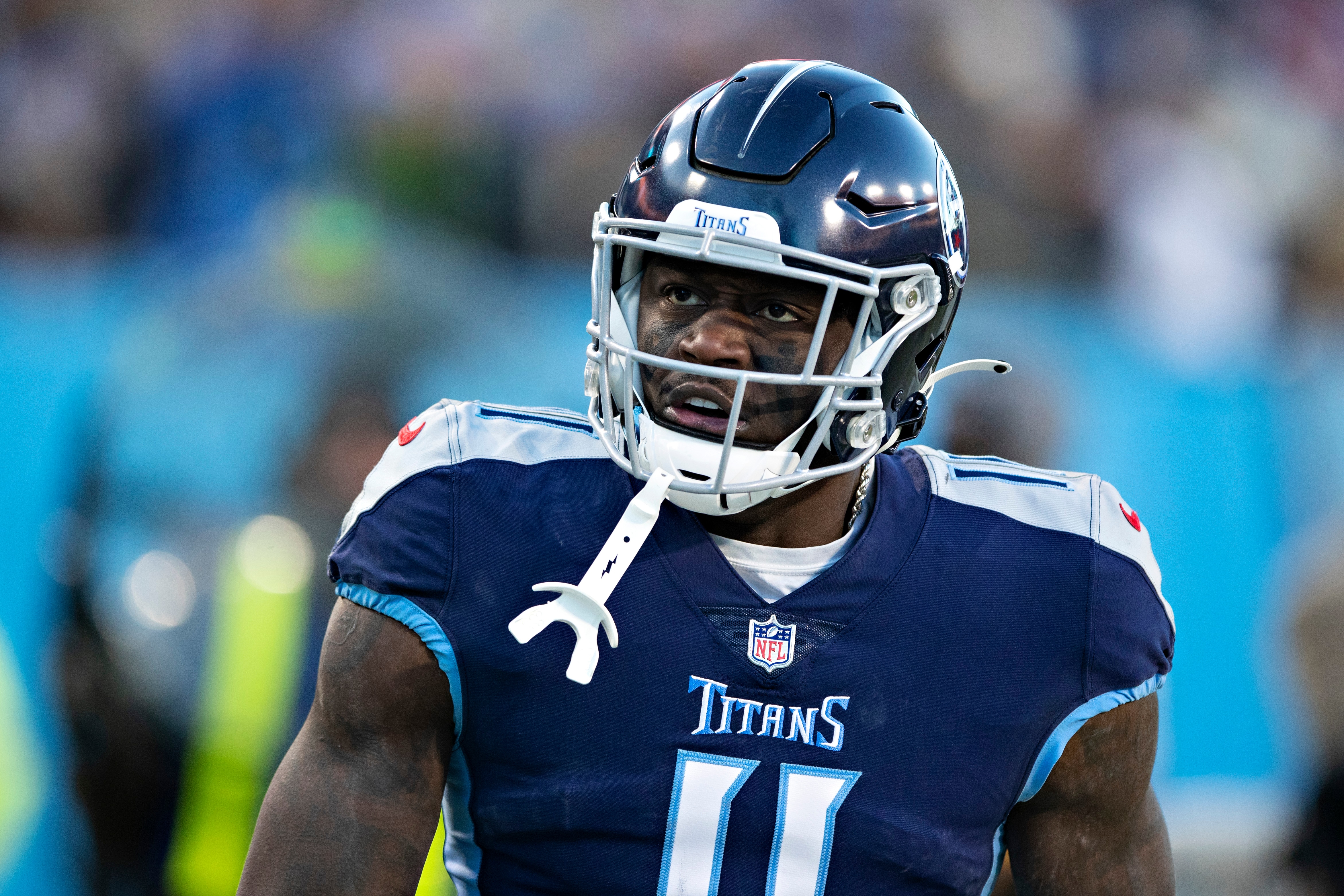 NASHVILLE, TENNESSEE - JANUARY 22: A.J. Brown #11 of the Tennessee Titans watches the replay on the scoreboard during a game against the Cincinnati Bengals in the AFC Divisional Playoff game at Nissan Stadium on January 22, 2022 in Nashville, Tennessee. The Bengals defeated the Titans 19-16.  (Photo by Wesley Hitt/Getty Images)