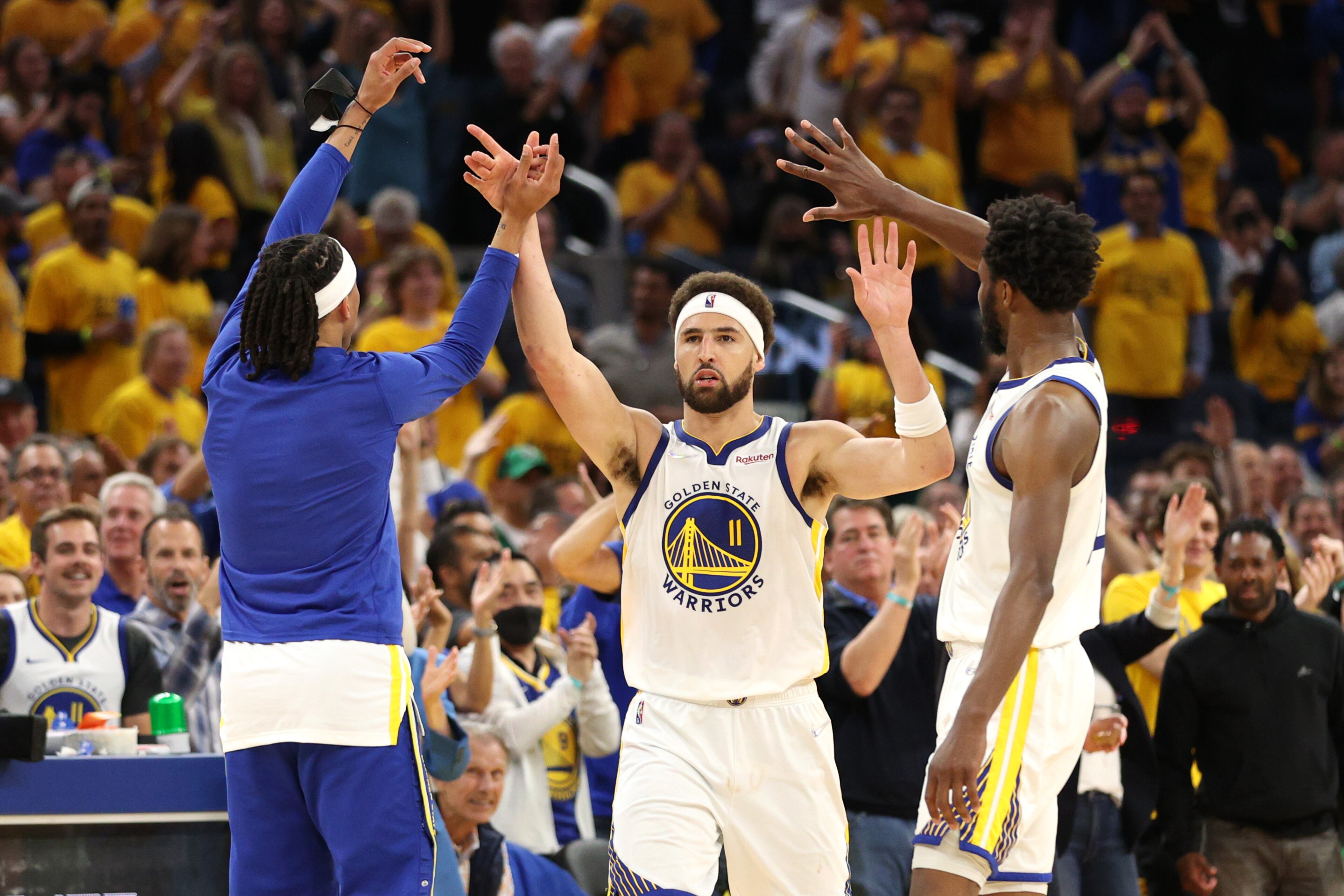 SAN FRANCISCO, CALIFORNIA - JUNE 13: Klay Thompson #11 of the Golden State Warriors celebrates his three point basket with teammates Damion Lee #1 and Andrew Wiggins #22 of the Golden State Warriors during the fourth quarter against the Boston Celtics in Game Five of the 2022 NBA Finals at Chase Center on June 13, 2022 in San Francisco, California. NOTE TO USER: User expressly acknowledges and agrees that, by downloading and/or using this photograph, User is consenting to the terms and conditions of the Getty Images License Agreement. (Photo by Ezra Shaw/Getty Images) SAN FRANCISCO, CALIFORNIA - JUNE 13: Klay Thompson #11 of the Golden State Warriors celebrates his three point basket with teammates Damion Lee #1 and Andrew Wiggins #22 of the Golden State Warriors during the fourth quarter against the Boston Celtics in Game Five of the 2022 NBA Finals at Chase Center on June 13, 2022 in San Francisco, California. NOTE TO USER: User expressly acknowledges and agrees that, by downloading and/or using this photograph, User is consenting to the terms and conditions of the Getty Images License Agreement. (Photo by Ezra Shaw/Getty Images)