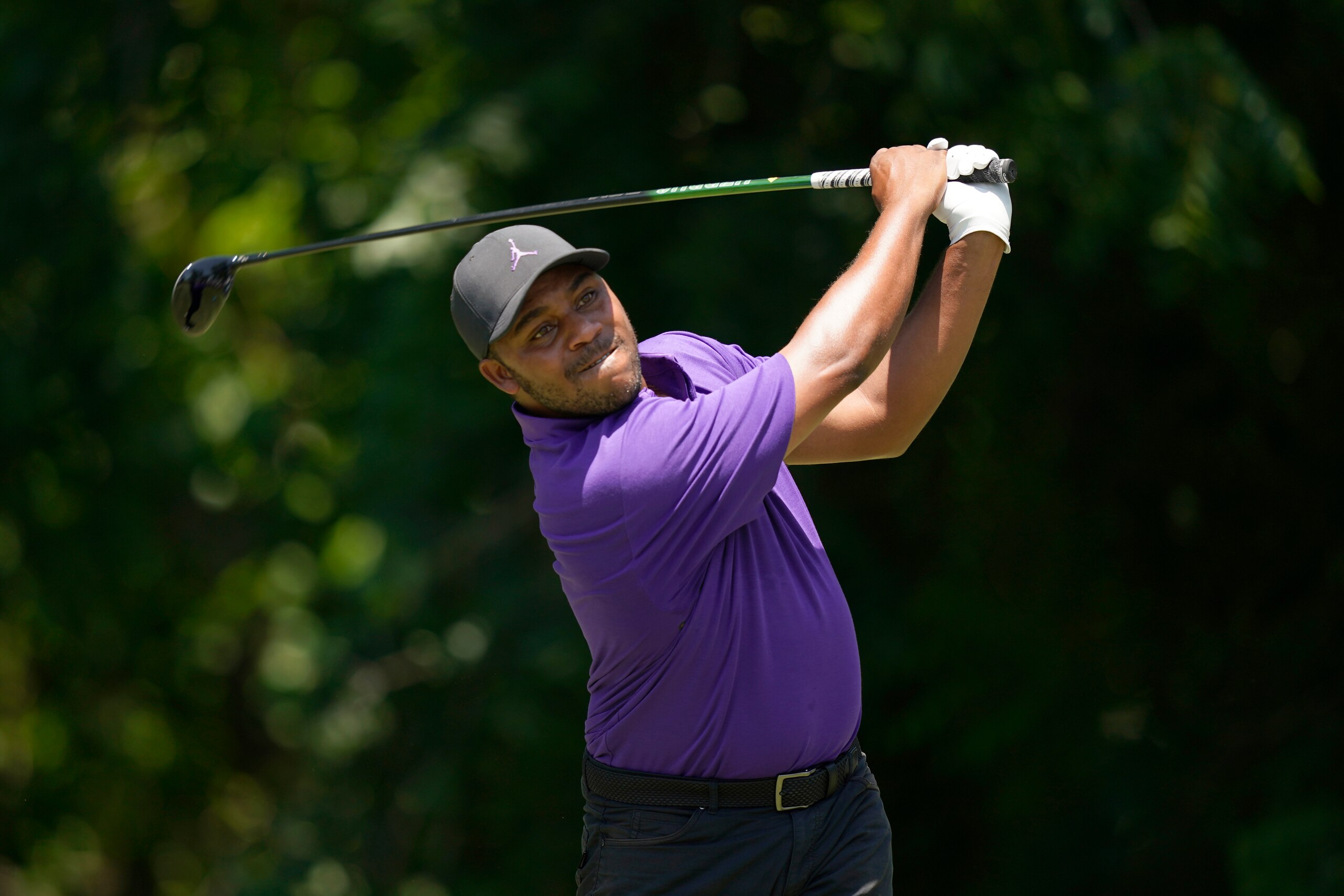 Harold Varner III hits a tee shot on the sixth hole during during the final round of the Charles Schwab Challenge golf tournament at the Colonial Country Club in Fort Worth, Texas, Sunday, May 29, 2022. (AP Photo/LM Otero)