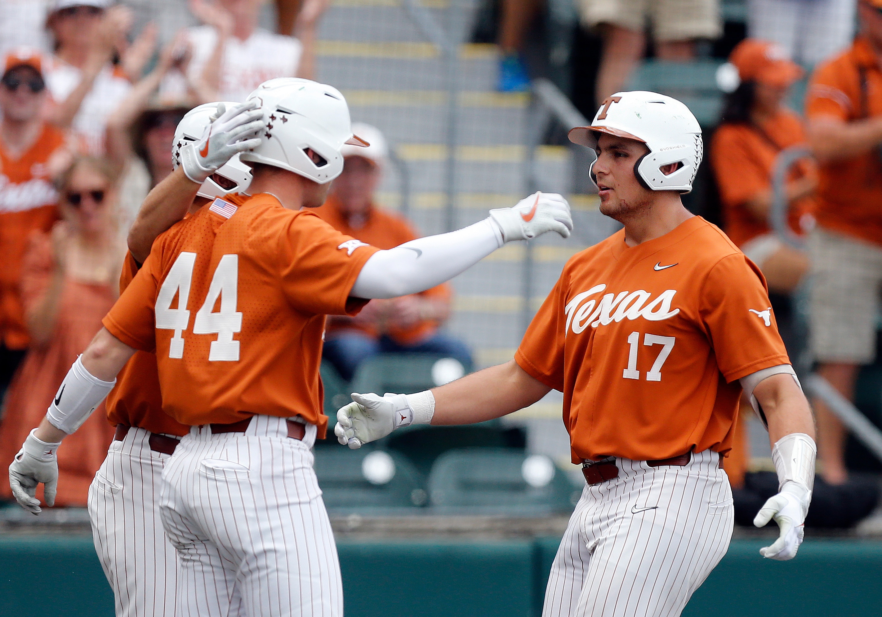 AUSTIN, TX - APRIL 24: Texas Longhorns first baseman Ivan Melendez (right) gets congratulated by designed hitter Todd Austin (left) after Melendez hits a home run against the Baylor Bears during the game on April 24, 2022, at UFCU Disch-Falk Field in Austin, TX. (Photo by Adam Davis/Icon Sportswire via Getty Images)