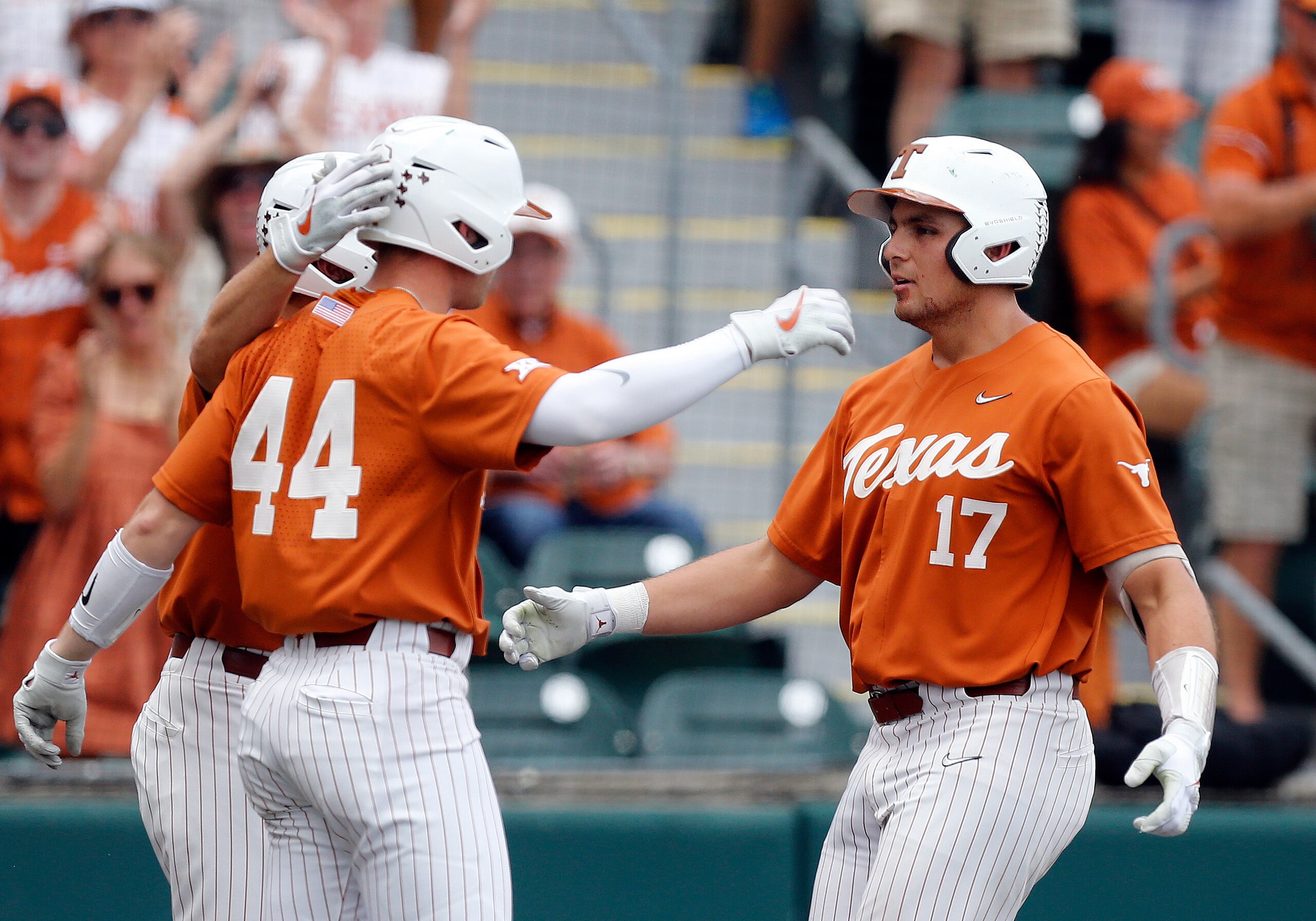 AUSTIN, TX - APRIL 24: Texas Longhorns first baseman Ivan Melendez (right) gets congratulated by designed hitter Todd Austin (left) after Melendez hits a home run against the Baylor Bears during the game on April 24, 2022, at UFCU Disch-Falk Field in Austin, TX. (Photo by Adam Davis/Icon Sportswire via Getty Images)