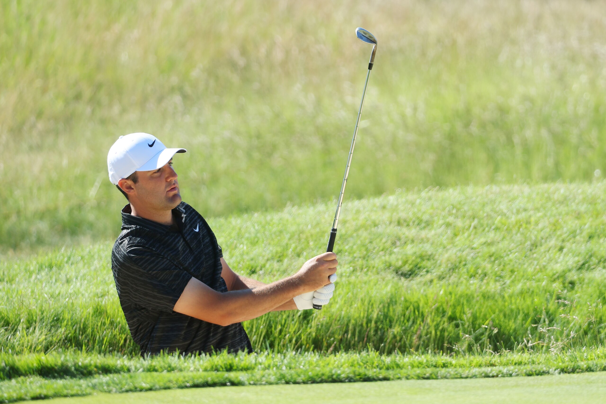 BROOKLINE, MASSACHUSETTS - JUNE 14: Scottie Scheffler of the United States watches his chip to the second green during a practice round prior to the US Open at The Country Club on June 14, 2022 in Brookline, Massachusetts. (Photo by Andrew Redington/Getty Images)