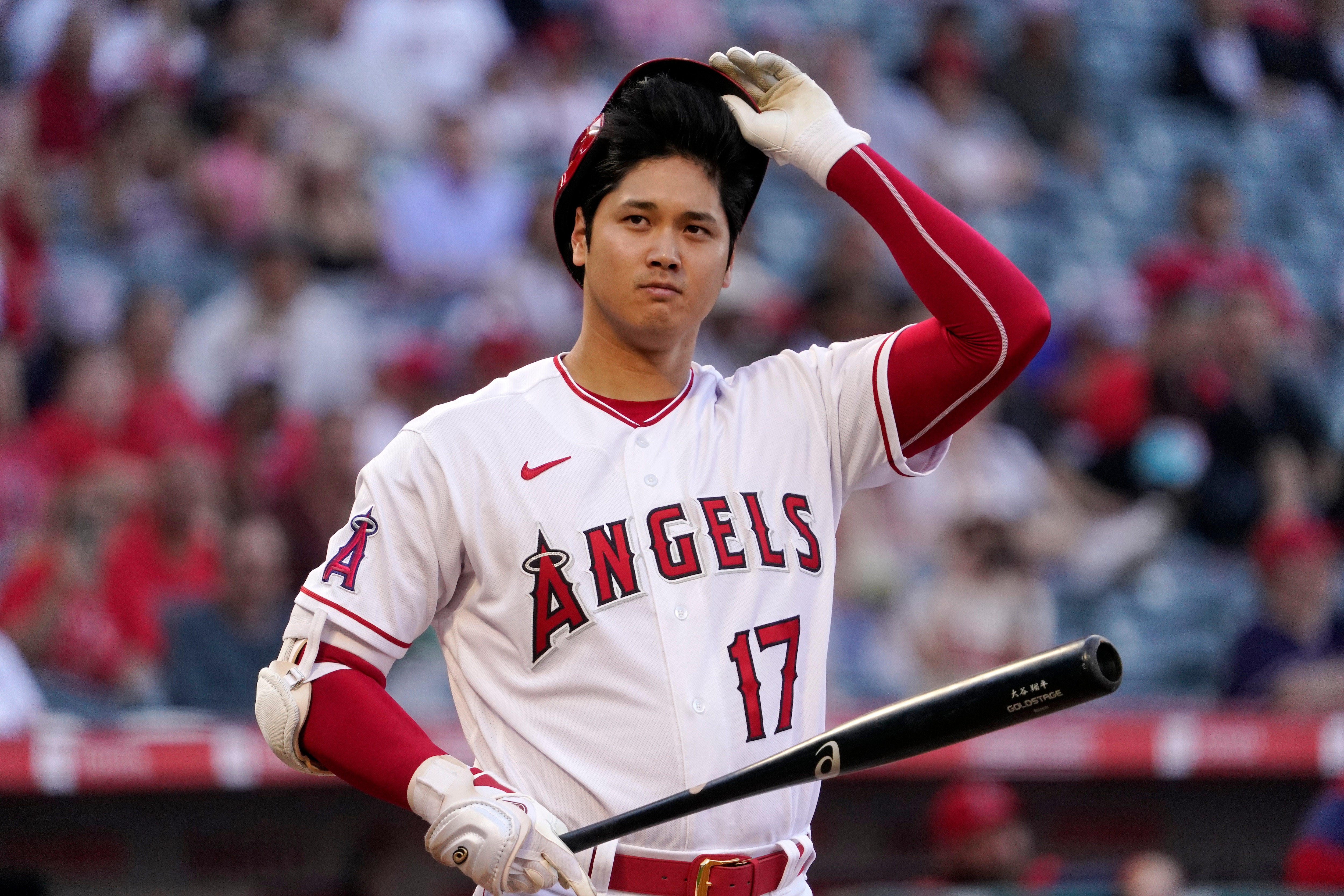 Los Angeles Angels' Shohei Ohtani tips his helmet before hitting during the first inning of a baseball game against the New York Mets Friday, June 10, 2022, in Anaheim, Calif. (AP Photo/Mark J. Terrill)