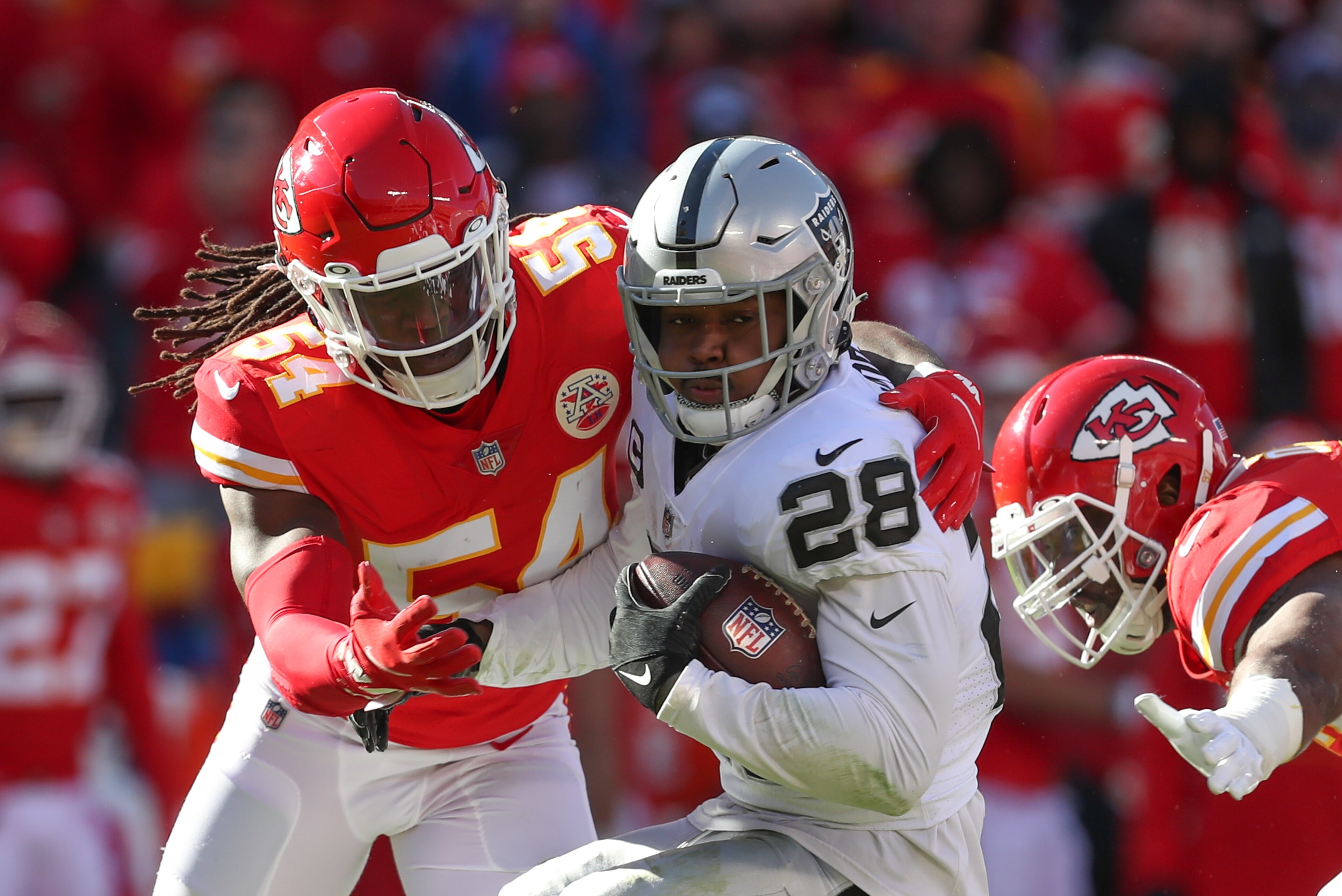KANSAS CITY, MO - DECEMBER 12: Kansas City Chiefs outside linebacker Nick Bolton (54) stops Las Vegas Raiders running back Josh Jacobs (28) in the second quarter of an NFL game between the Las Vegas Raiders and Kansas City Chiefs on Dec 12, 2021 at GEHA Field at Arrowhead Stadium in Kansas City, MO. (Photo by Scott Winters/Icon Sportswire via Getty Images) KANSAS CITY, MO - DECEMBER 12: Kansas City Chiefs outside linebacker Nick Bolton (54) stops Las Vegas Raiders running back Josh Jacobs (28) in the second quarter of an NFL game between the Las Vegas Raiders and Kansas City Chiefs on Dec 12, 2021 at GEHA Field at Arrowhead Stadium in Kansas City, MO. (Photo by Scott Winters/Icon Sportswire via Getty Images)