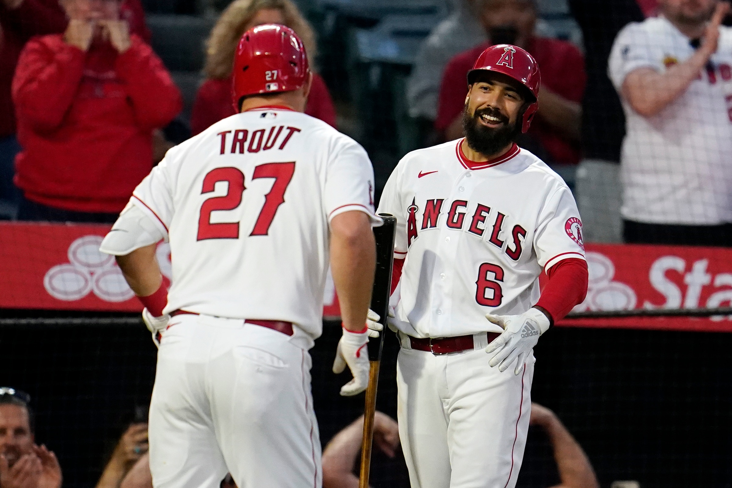 Los Angeles Angels' Mike Trout (27) celebrates his solo home run with Anthony Rendon (6) during the fifth inning of the team's baseball game against the Baltimore Orioles on Saturday, April 23, 2022, in Anaheim, Calif. (AP Photo/Marcio Jose Sanchez)