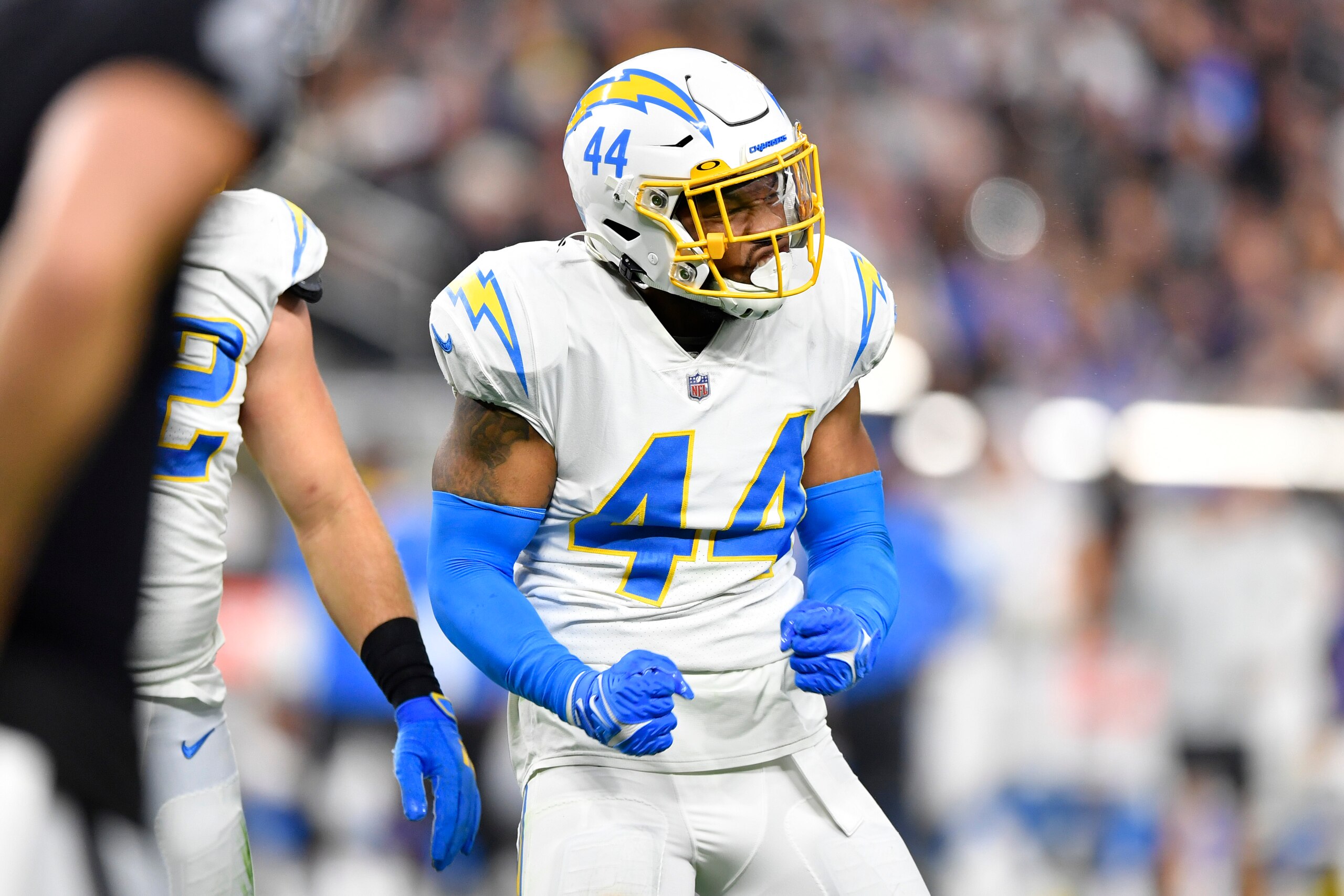 LAS VEGAS, NEVADA - JANUARY 09:  Outside linebacker Kyzir White #44 of the Los Angeles Chargers reacts after a tackle for a loss against the Las Vegas Raiders during the first half of a game at Allegiant Stadium on January 09, 2022 in Las Vegas, Nevada. The Raiders defeated the Chargers 35-32 in overtime. (Photo by Chris Unger/Getty Images)