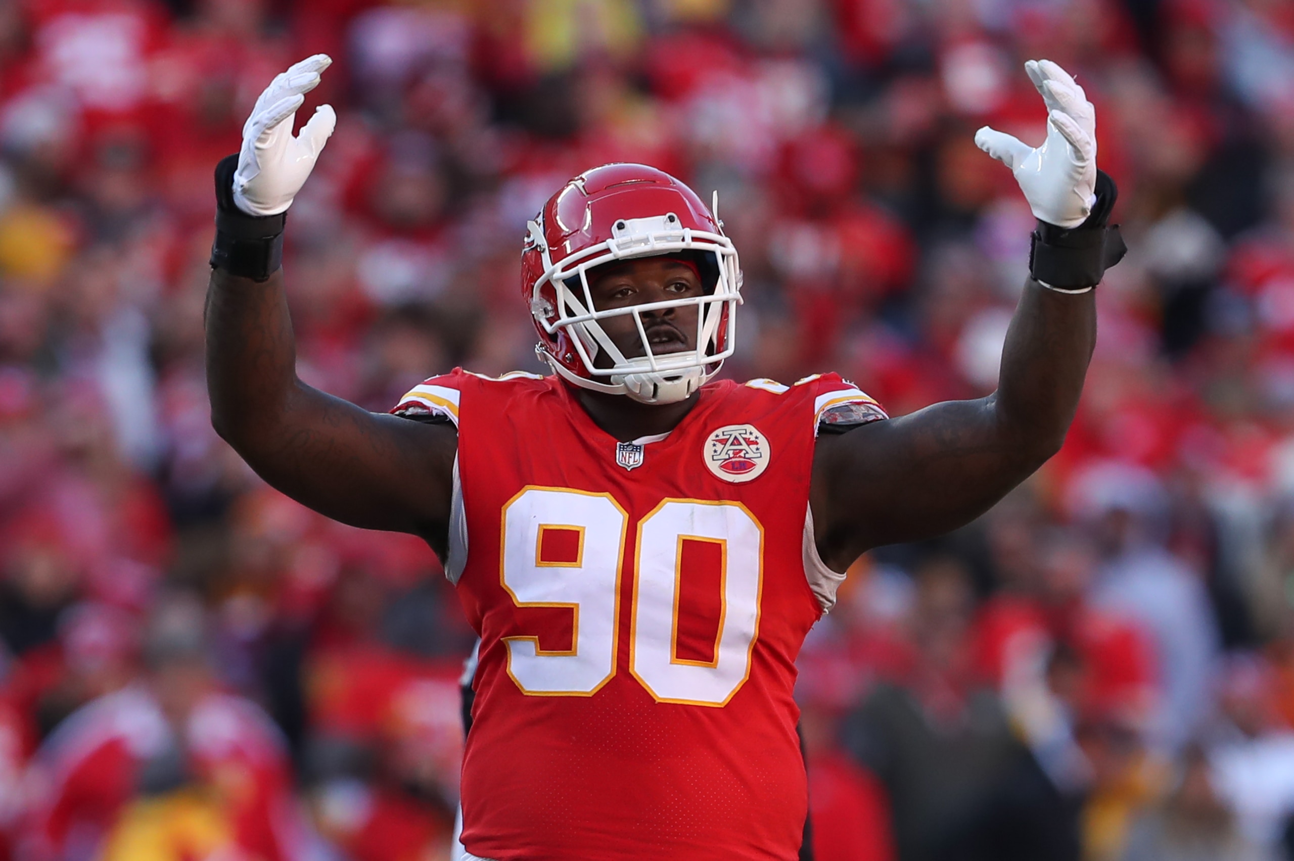 KANSAS CITY, MO - JANUARY 30: Kansas City Chiefs defensive tackle Jarran Reed (90) raises his hands in the second quarter of the AFC Championship game between the Cincinnati Bengals and Kansas City Chiefs on Jan 30, 2022 at GEHA Field at Arrowhead Stadium in Kansas City, MO. (Photo by Scott Winters/Icon Sportswire via Getty Images)