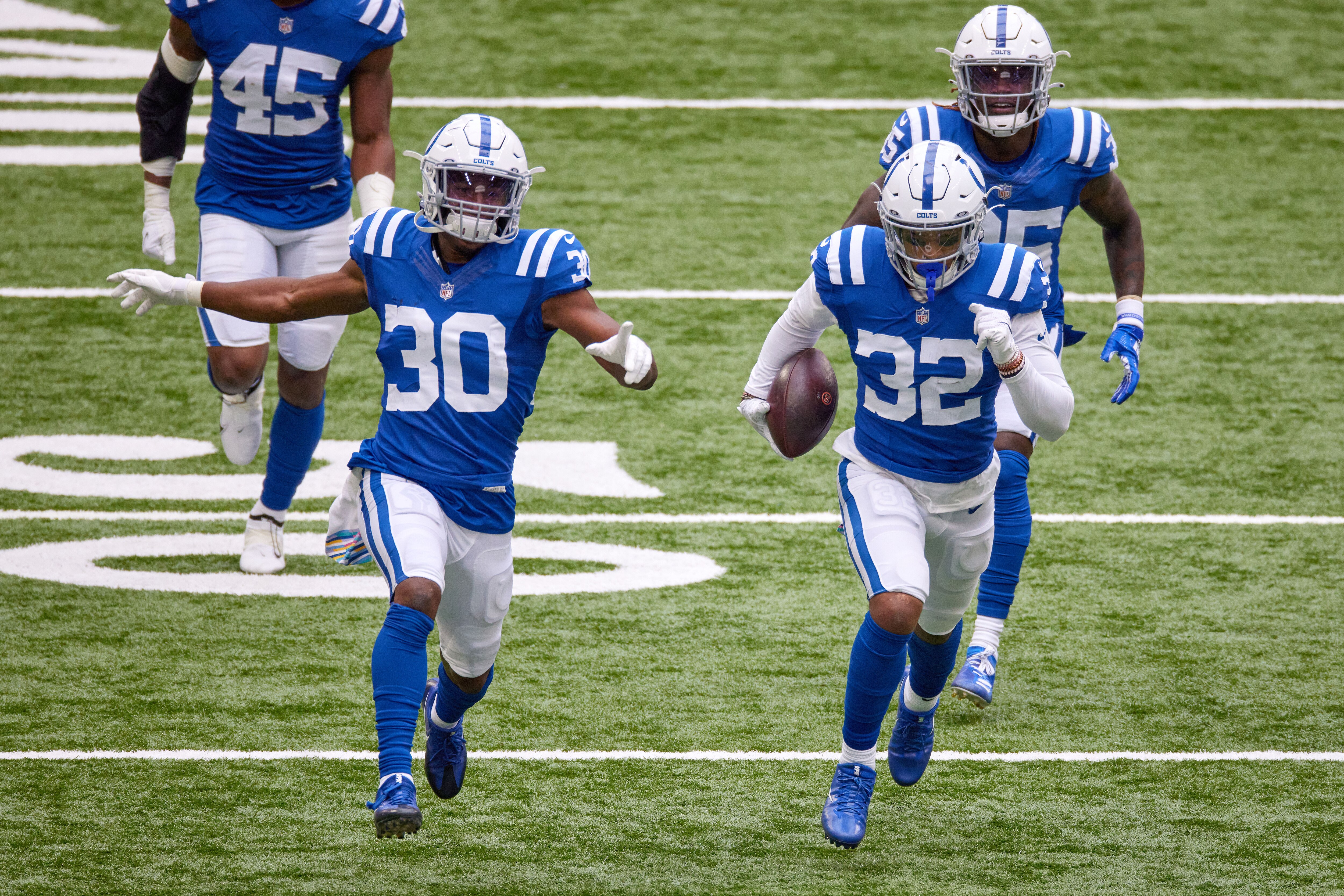 INDIANAPOLIS, IN - OCTOBER 18: Indianapolis Colts Safety Julian Blackmon (32) celebrates with Indianapolis Colts Safety George Odum (30) and points down field after intercepting the football in game action during a NFL game between the Indianapolis Colts and the Cincinnati Bengals on October 18, 2020, at Lucas Oil Stadium in Indianapolis, IN. (Photo by MSA/Icon Sportswire via Getty Images)