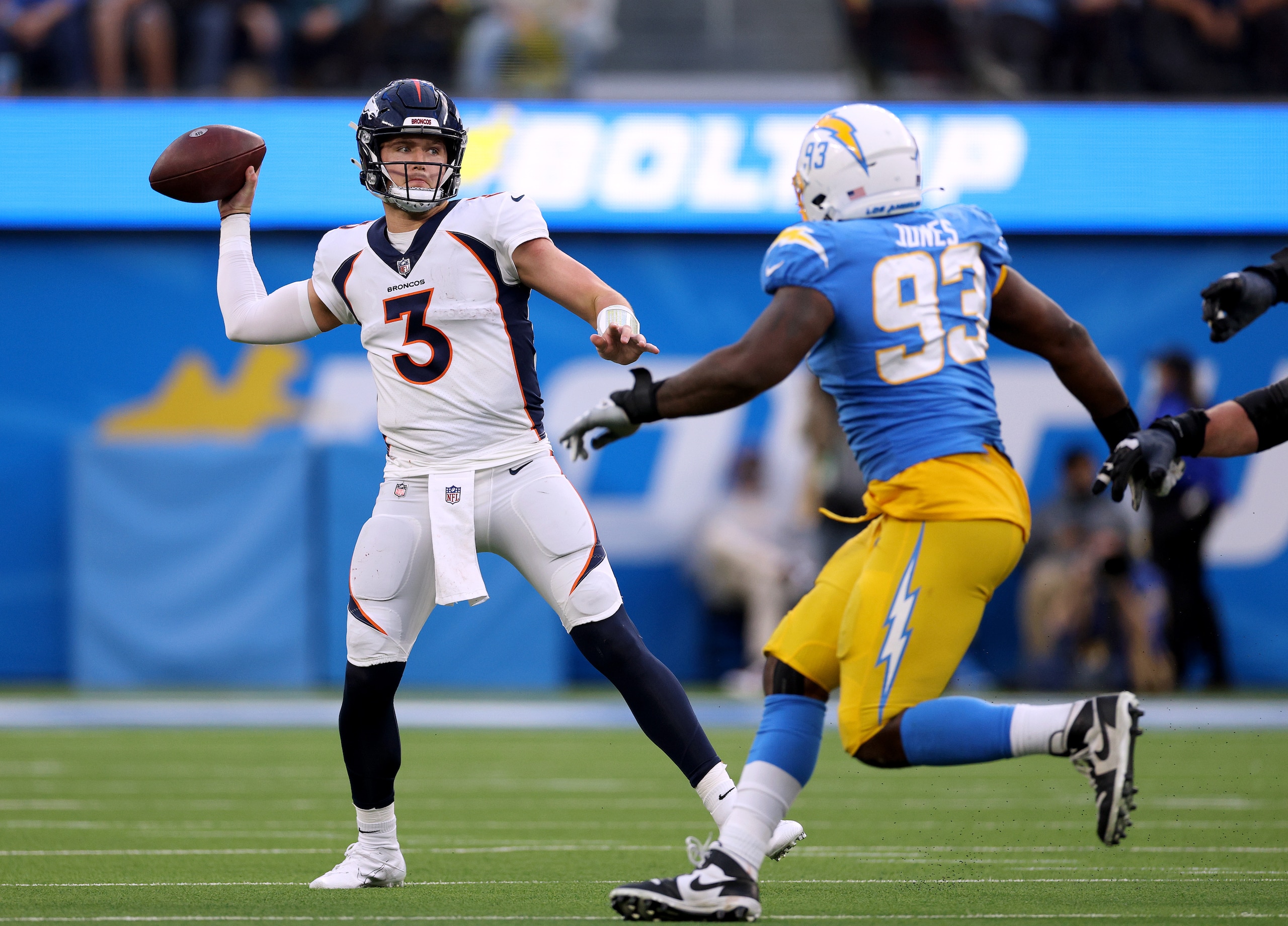 INGLEWOOD, CALIFORNIA - JANUARY 02: Drew Lock #3 of the Denver Broncos attempts a pass in front of Justin Jones #93 of the Los Angeles Chargers during a 34-13 loss to the Chargers at SoFi Stadium on January 02, 2022 in Inglewood, California. (Photo by Harry How/Getty Images) INGLEWOOD, CALIFORNIA - JANUARY 02: Drew Lock #3 of the Denver Broncos attempts a pass in front of Justin Jones #93 of the Los Angeles Chargers during a 34-13 loss to the Chargers at SoFi Stadium on January 02, 2022 in Inglewood, California. (Photo by Harry How/Getty Images)