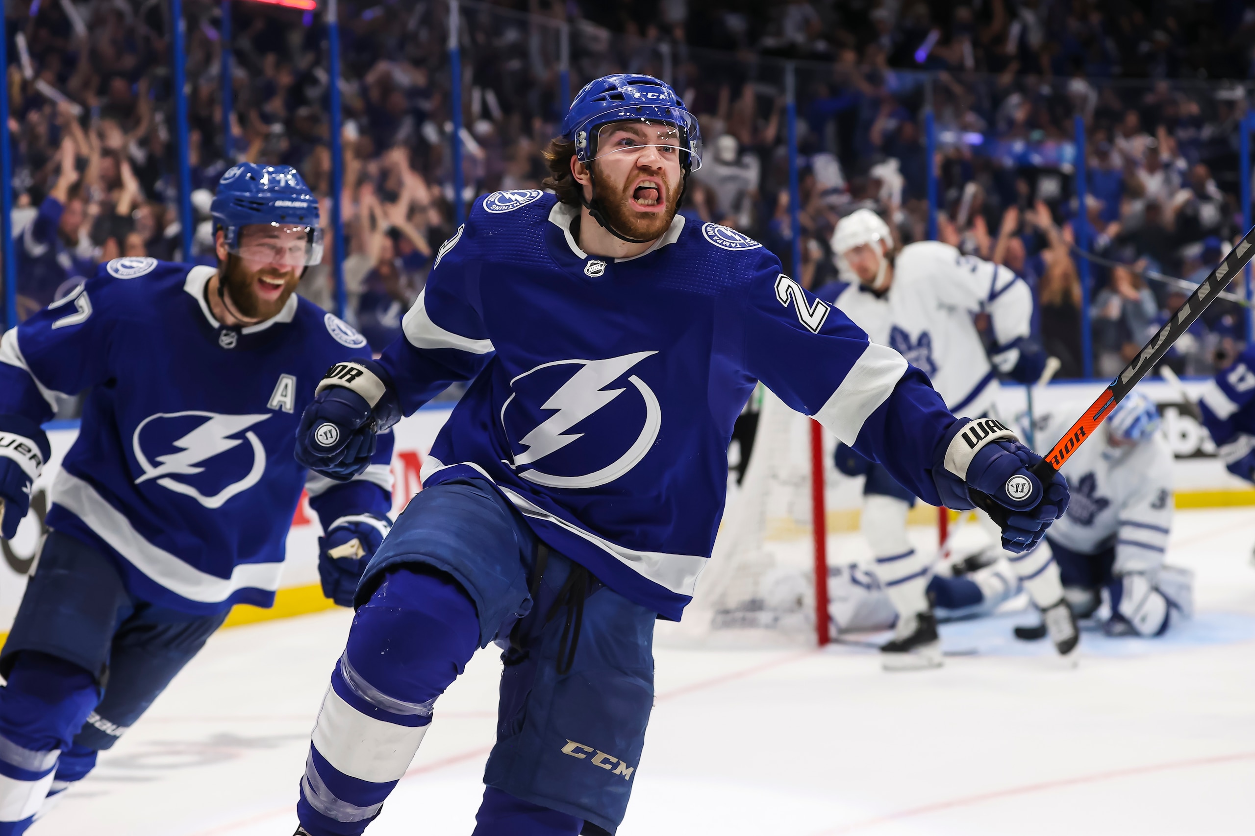 TAMPA, FL - MAY 12: Brayden Point #21 of the Tampa Bay Lightning celebrates the game winning goal against goalie Jack Campbell #36 of the Toronto Maple Leafs during overtime in Game Six of the First Round of the 2022 Stanley Cup Playoffs at Amalie Arena on May 12, 2022 in Tampa, Florida. (Photo by Mark LoMoglio/NHLI via Getty Images)