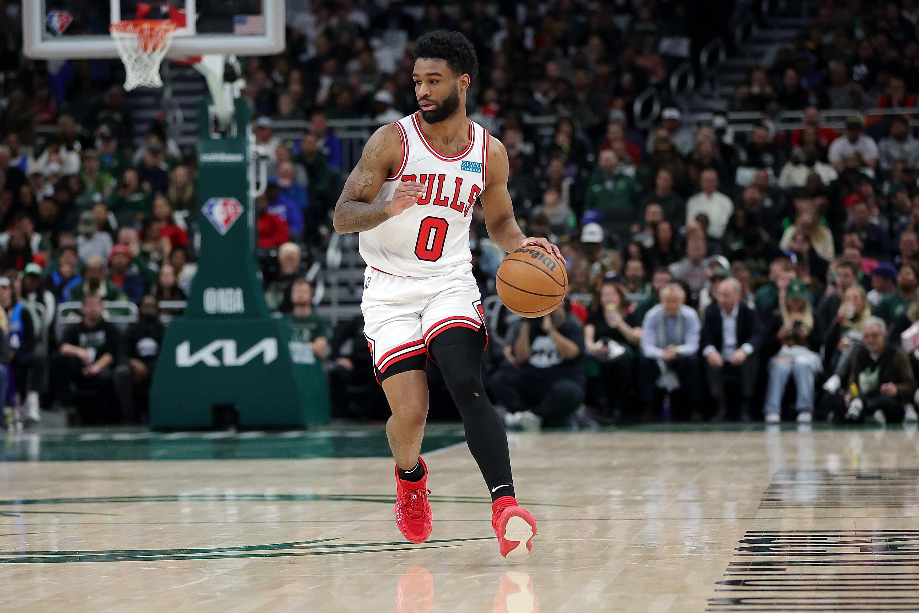 MILWAUKEE, WISCONSIN - APRIL 27: Coby White #0 of the Chicago Bulls handles the ball during Game Five of the Eastern Conference First Round Playoffs against the Milwaukee Bucks at Fiserv Forum on April 27, 2022 in Milwaukee, Wisconsin. NOTE TO USER: User expressly acknowledges and agrees that, by downloading and or using this photograph, User is consenting to the terms and conditions of the Getty Images License Agreement. (Photo by Stacy Revere/Getty Images)
