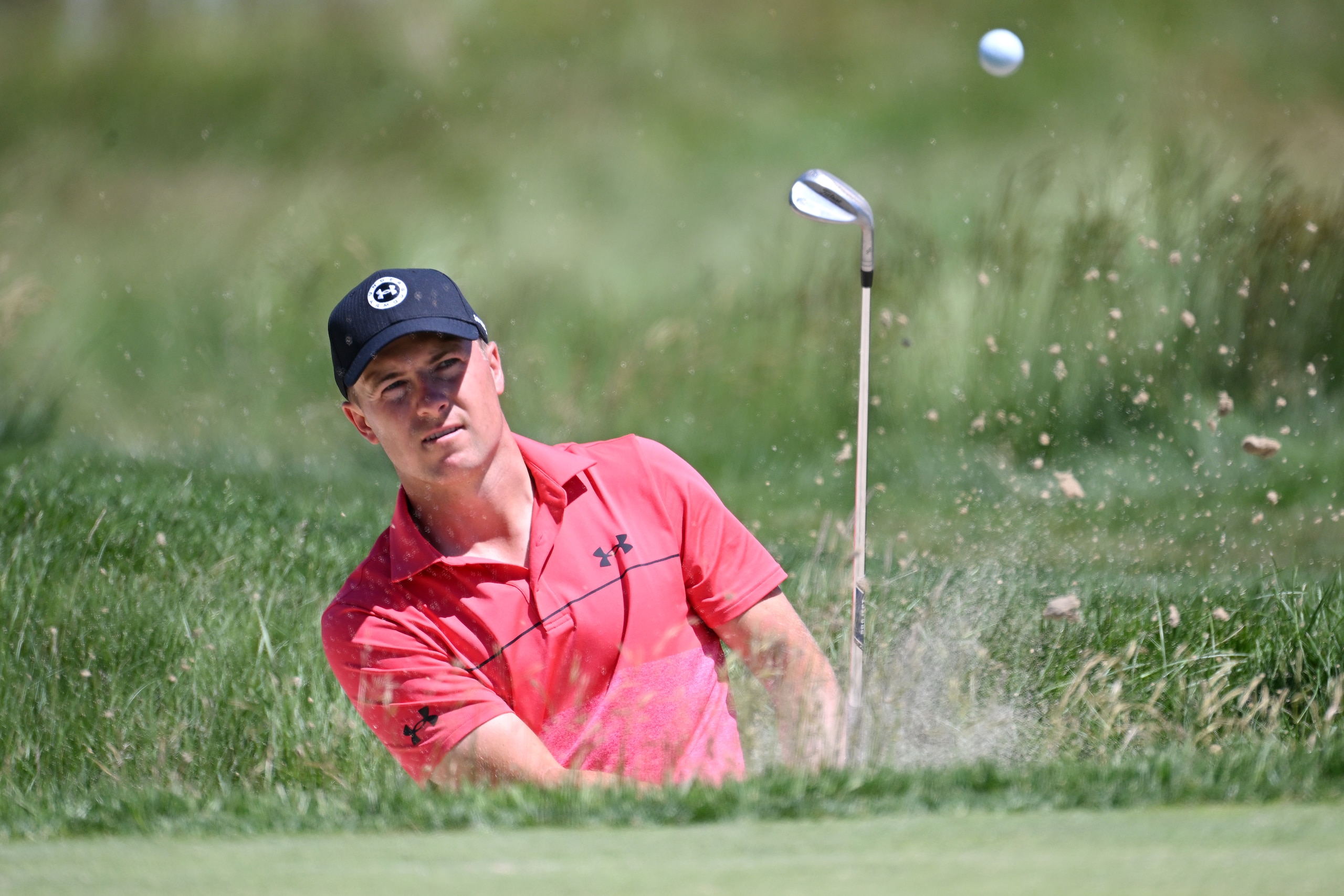 BROOKLINE, MASSACHUSETTS - JUNE 14: Jordan Spieth of the United States plays a shot from a bunker on the second hole during a practice round prior to the US Open at The Country Club on June 14, 2022 in Brookline, Massachusetts. (Photo by Ross Kinnaird/Getty Images)