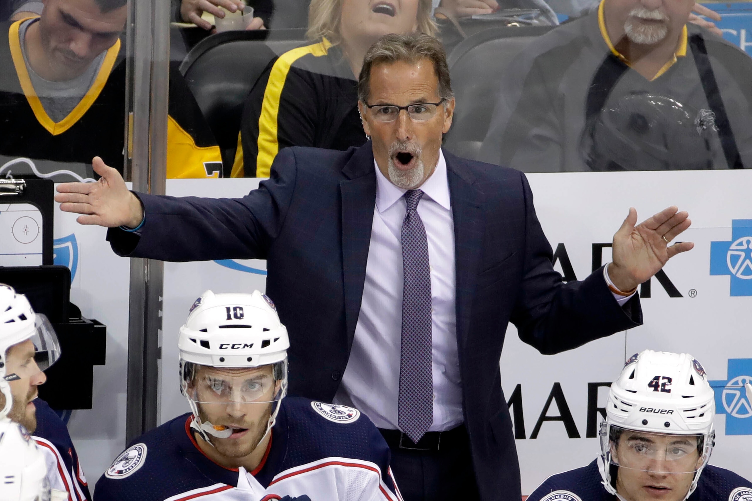 FILE - In this Oct. 5, 2019, file photo, Columbus Blue Jackets head coach John Tortorella objects to a call during the first period of an NHL hockey game against the Pittsburgh Penguins in Pittsburgh. With top-line center Pierre-Luc Dubois signed to a new contract and a solid second-line puck-handler Max Domi in place, the Columbus Blue Jackets will try to reach the NHL playoffs for the fifth straight season under coach John Tortorella. (AP Photo/Gene J. Puskar, File)