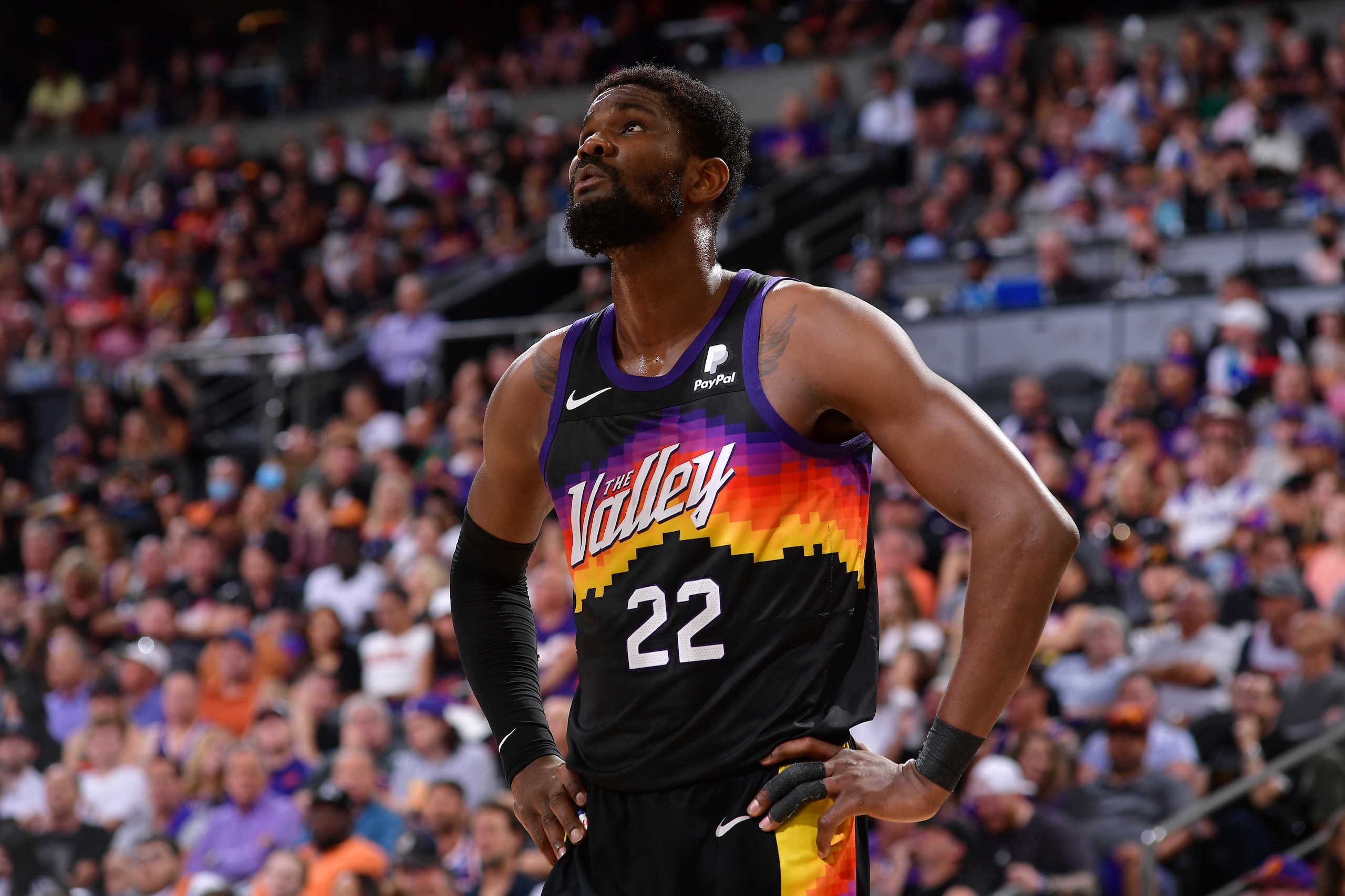 PHOENIX, AZ - MAY 2: Deandre Ayton #22 of the Phoenix Suns looks on during Game 1 of the 2022 NBA Playoffs Western Conference Semifinals on May 2, 2022 at Footprint Center in Phoenix, Arizona. NOTE TO USER: User expressly acknowledges and agrees that, by downloading and or using this photograph, user is consenting to the terms and conditions of the Getty Images License Agreement. Mandatory Copyright Notice: Copyright 2022 NBAE (Photo by Michael Gonzales/NBAE via Getty Images)