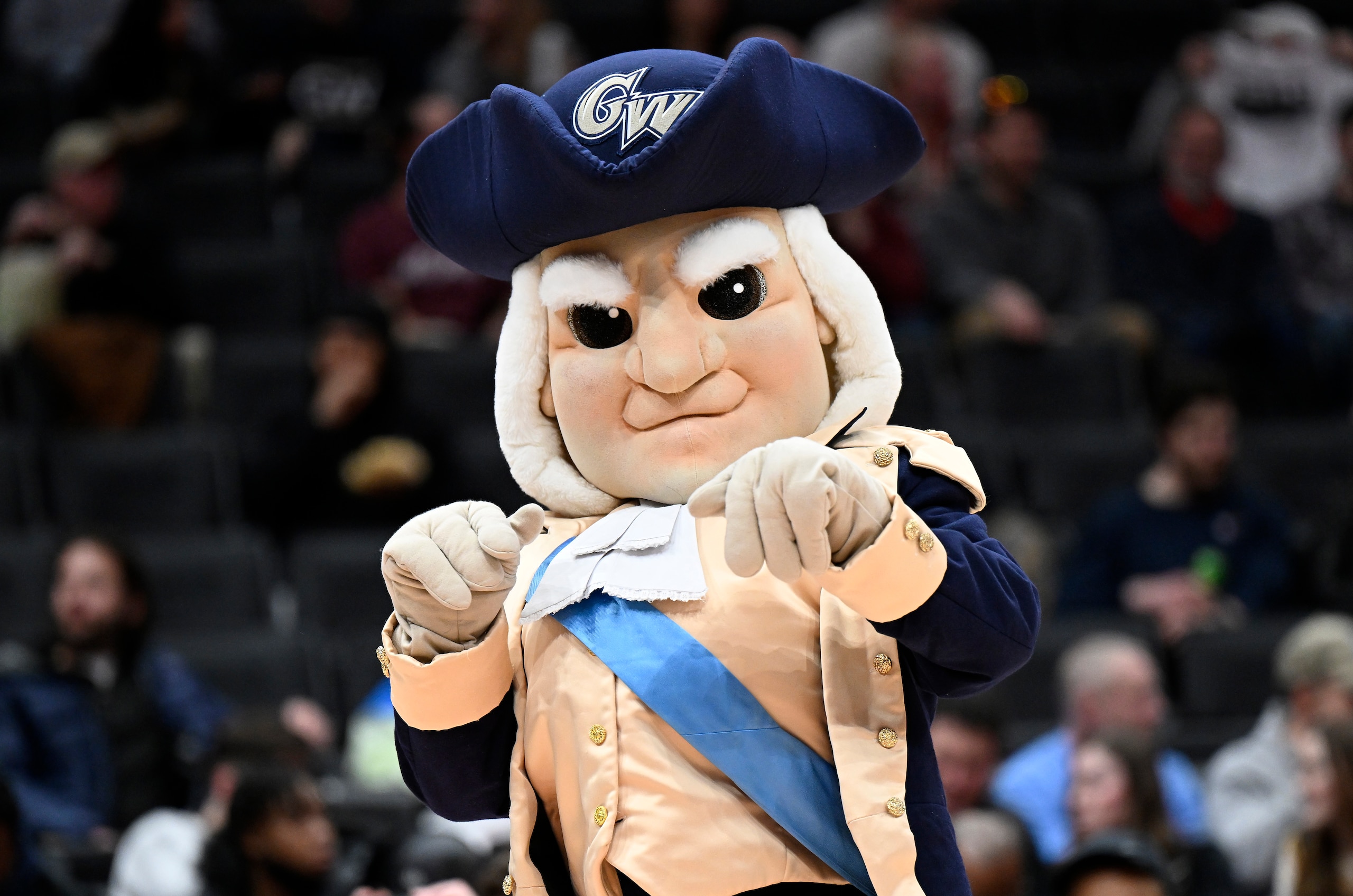 WASHINGTON, DC - MARCH 10: The George Washington Colonials mascot performs in the second half against the Massachusetts Minutemen during the Second Round of the 2022 Atlantic 10 Men's Basketball Tournament at Capital One Arena on March 10, 2022 in Washington, DC. (Photo by G Fiume/Getty Images)