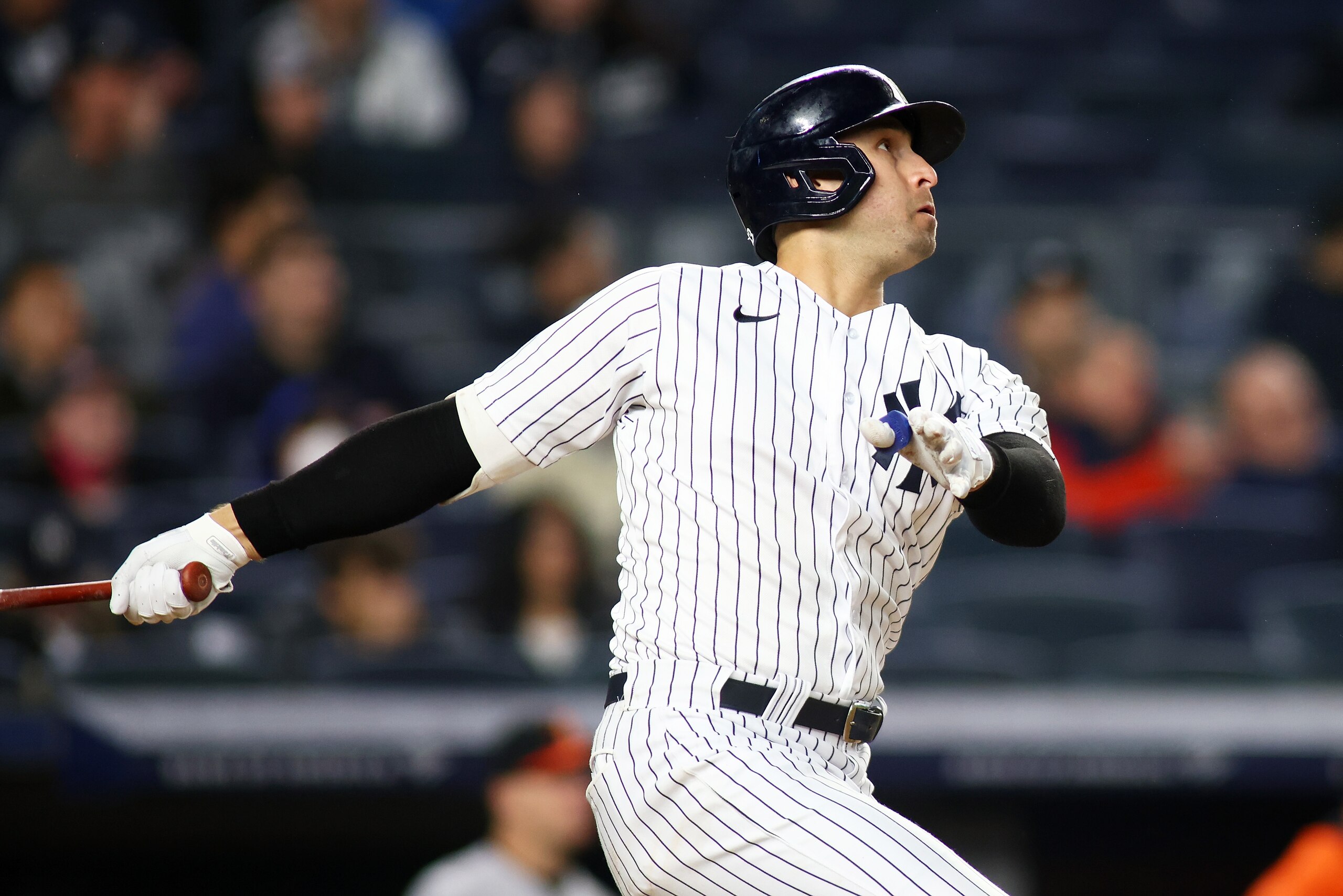 NEW YORK, NEW YORK - APRIL 26: Joey Gallo #13 of the New York Yankees hits a home run in the fourth inning against the Baltimore Orioles at Yankee Stadium on April 26, 2022 in New York City. (Photo by Mike Stobe/Getty Images)