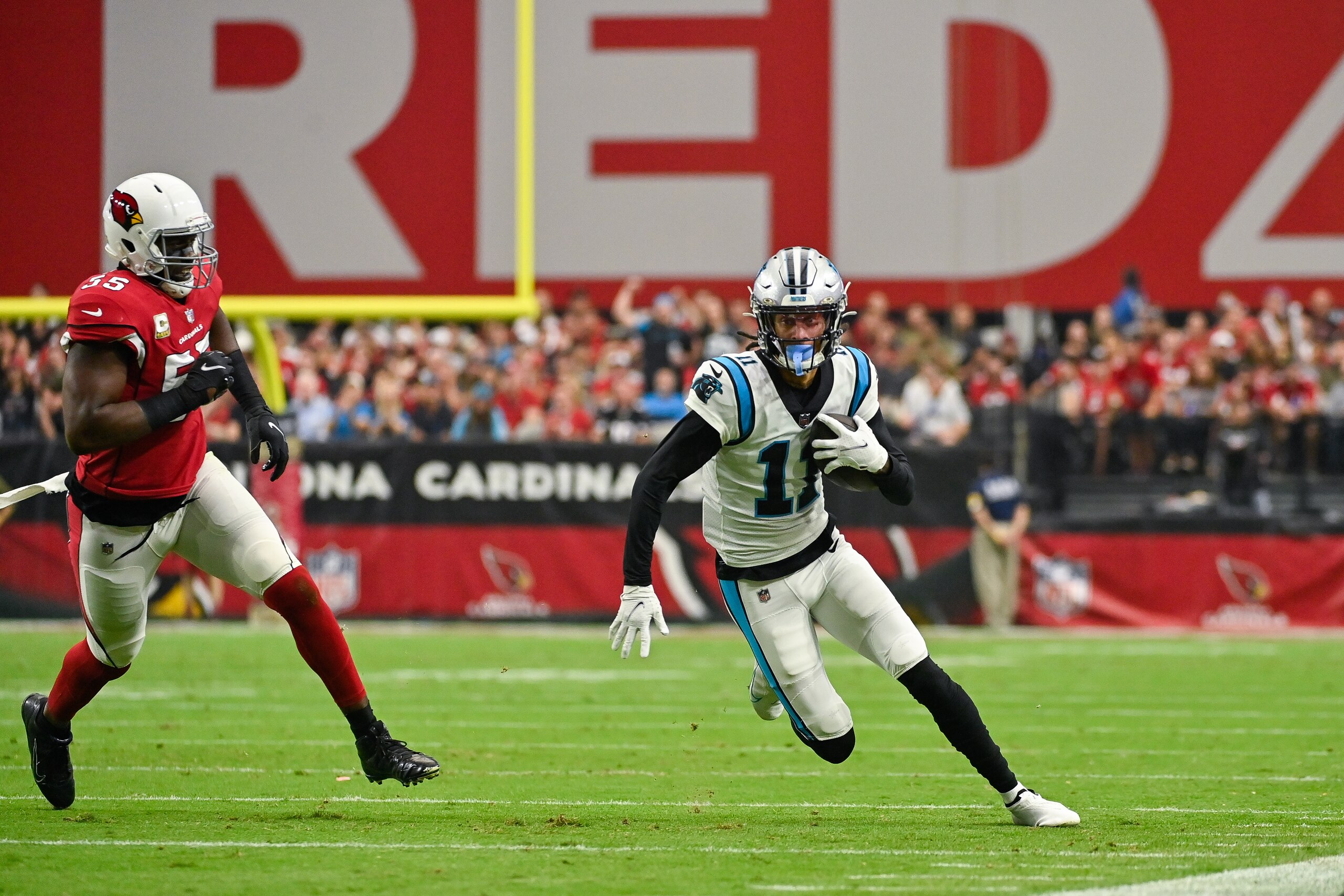 GLENDALE, ARIZONA - NOVEMBER 14: Robby Anderson #11 of the Carolina Panthers runs with the ball against Chandler Jones #55 of the Arizona Cardinals during the first quarter at State Farm Stadium on November 14, 2021 in Glendale, Arizona. The Panthers defeated the Cardinals 34-10. (Photo by Kelsey Grant/Getty Images)
