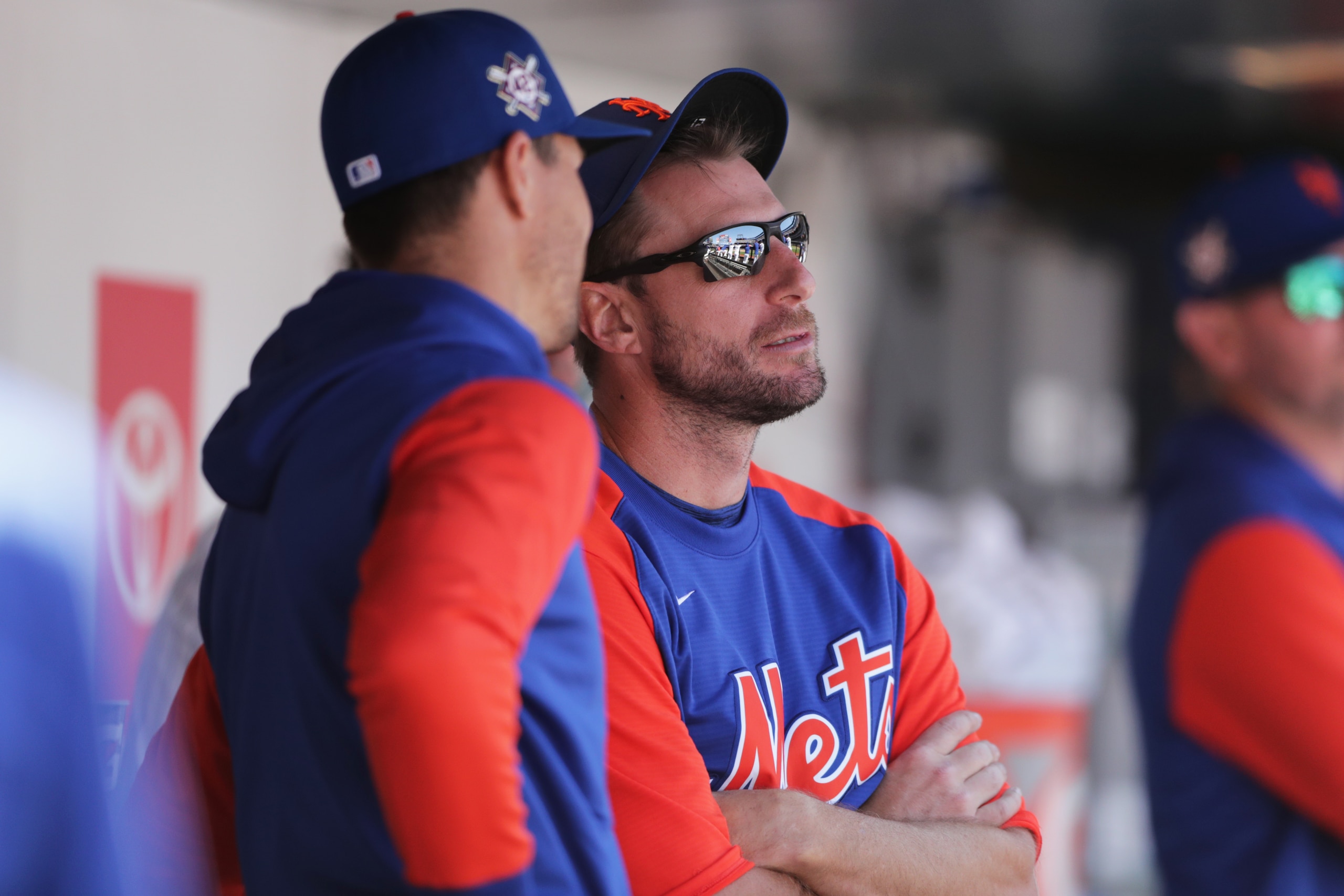 NEW YORK, NY - APRIL 15: Jacob deGrom #48 of the New York Mets talks with Max Scherzer #21 in the dugout during the game between the Arizona Diamondbacks and the New York Mets at Citi Field on Friday, April 15, 2022 in New York, New York. All players wear the number 42 on their jerseys in honor of Jackie Robinson. (Photo by Mary DeCicco/MLB Photos via Getty Images)