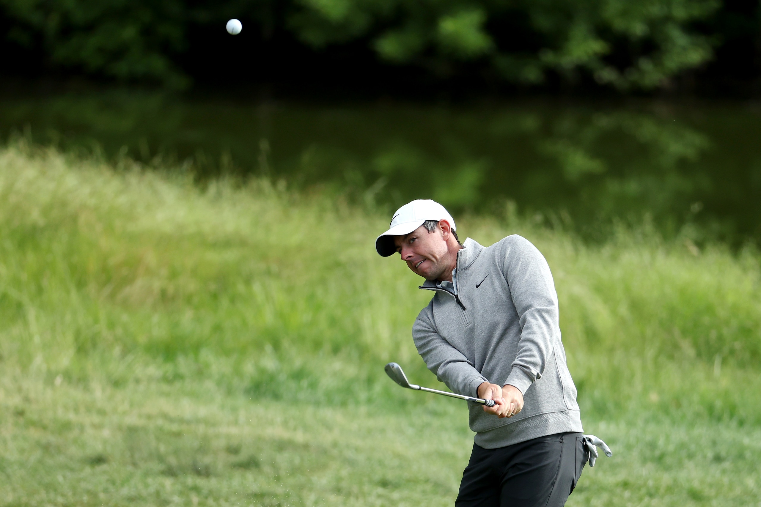 BROOKLINE, MASSACHUSETTS - JUNE 15: Rory McIlroy of Northern Ireland plays a shot on the ninth hole during a practice round prior to the US Open at The Country Club on June 15, 2022 in Brookline, Massachusetts. (Photo by Warren Little/Getty Images)