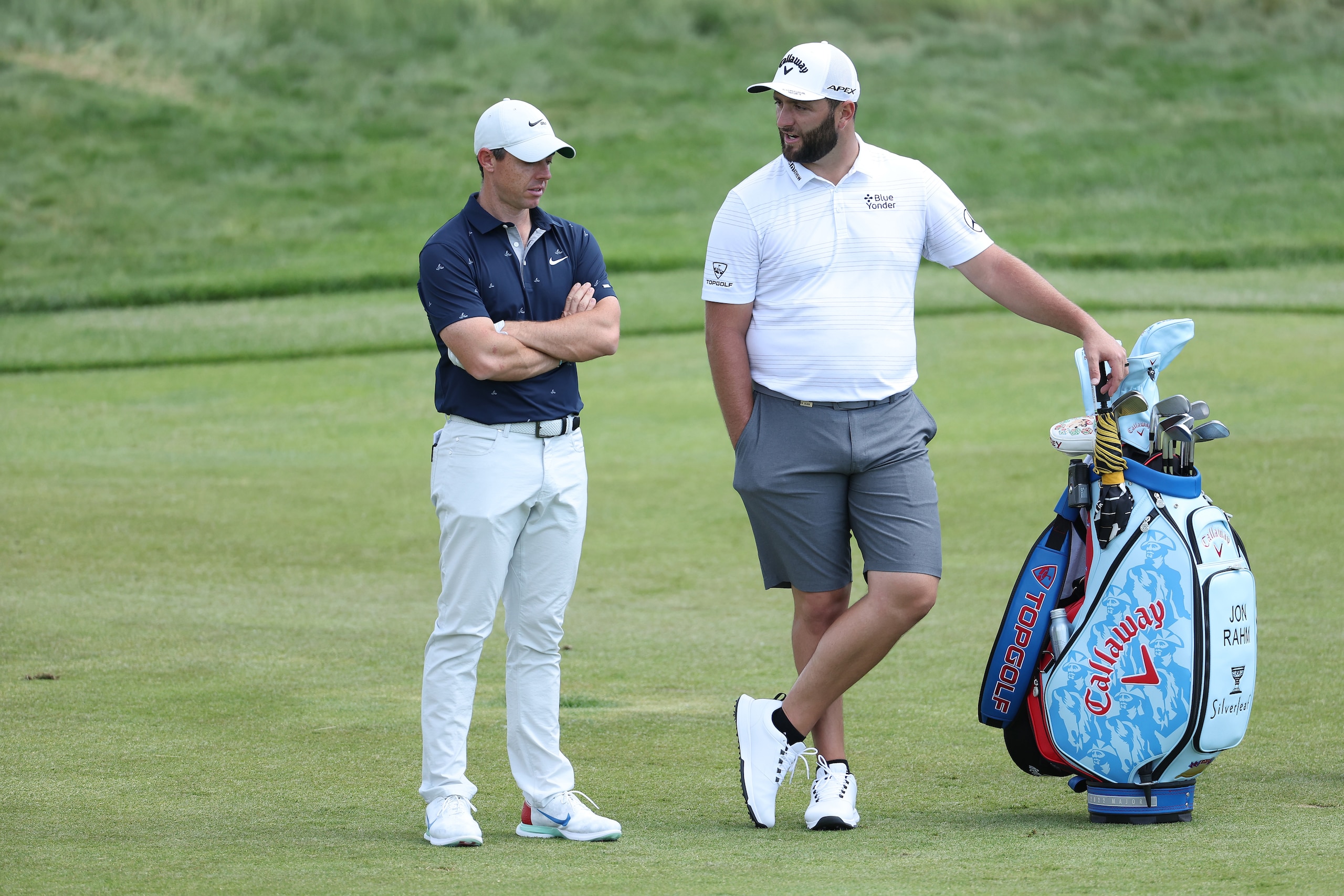 BROOKLINE, MASSACHUSETTS - JUNE 13: (L-R) Rory McIlroy of Northern Ireland and Jon Rahm of Spain stand on the third hole during a practice round prior to the 2022 U.S. Open at The Country Club on June 13, 2022 in Brookline, Massachusetts. (Photo by Warren Little/Getty Images)