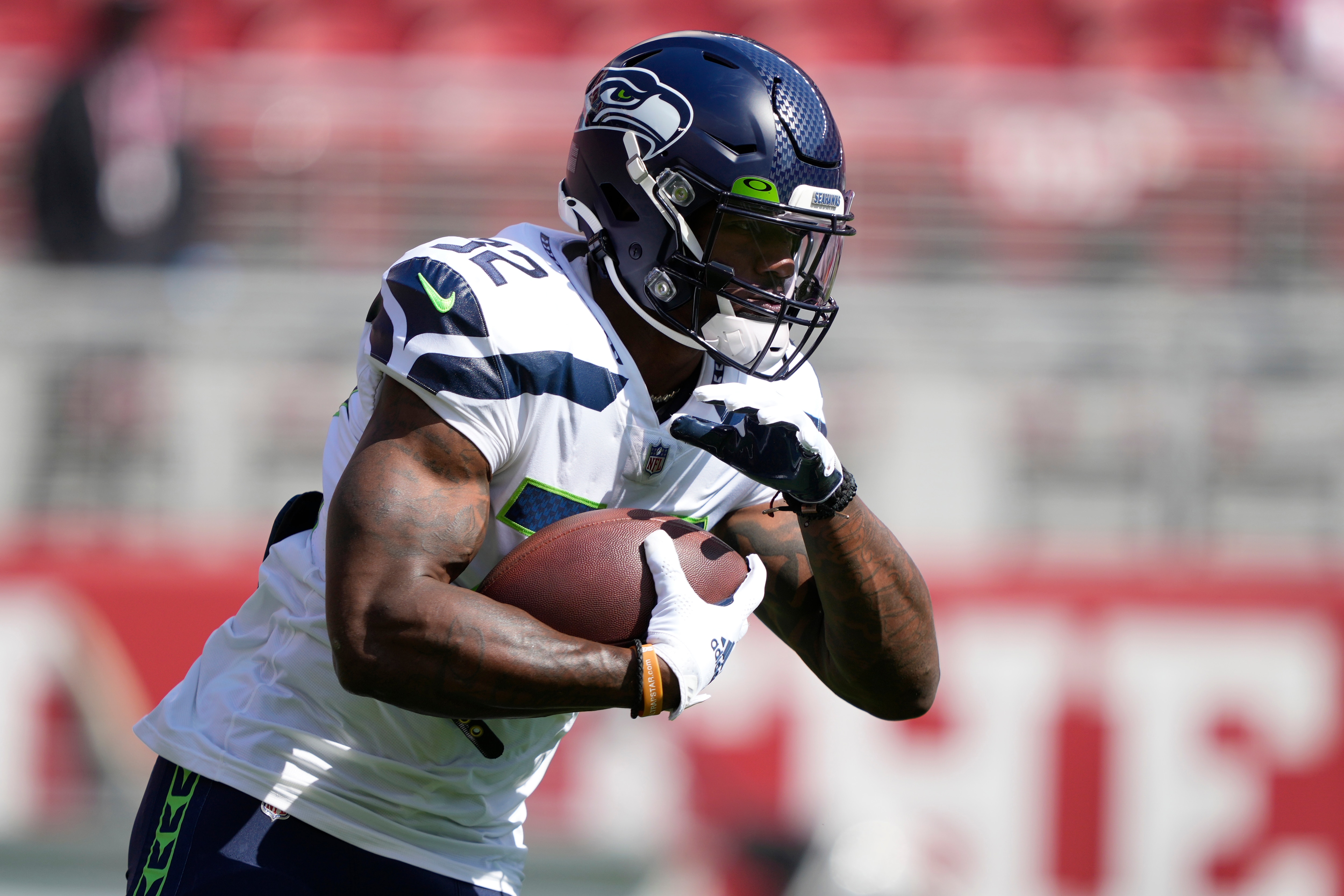 Seattle Seahawks running back Chris Carson warms up before an NFL football game against the San Francisco 49ers in Santa Clara, Calif., Sunday, Oct. 3, 2021. (AP Photo/Tony Avelar)