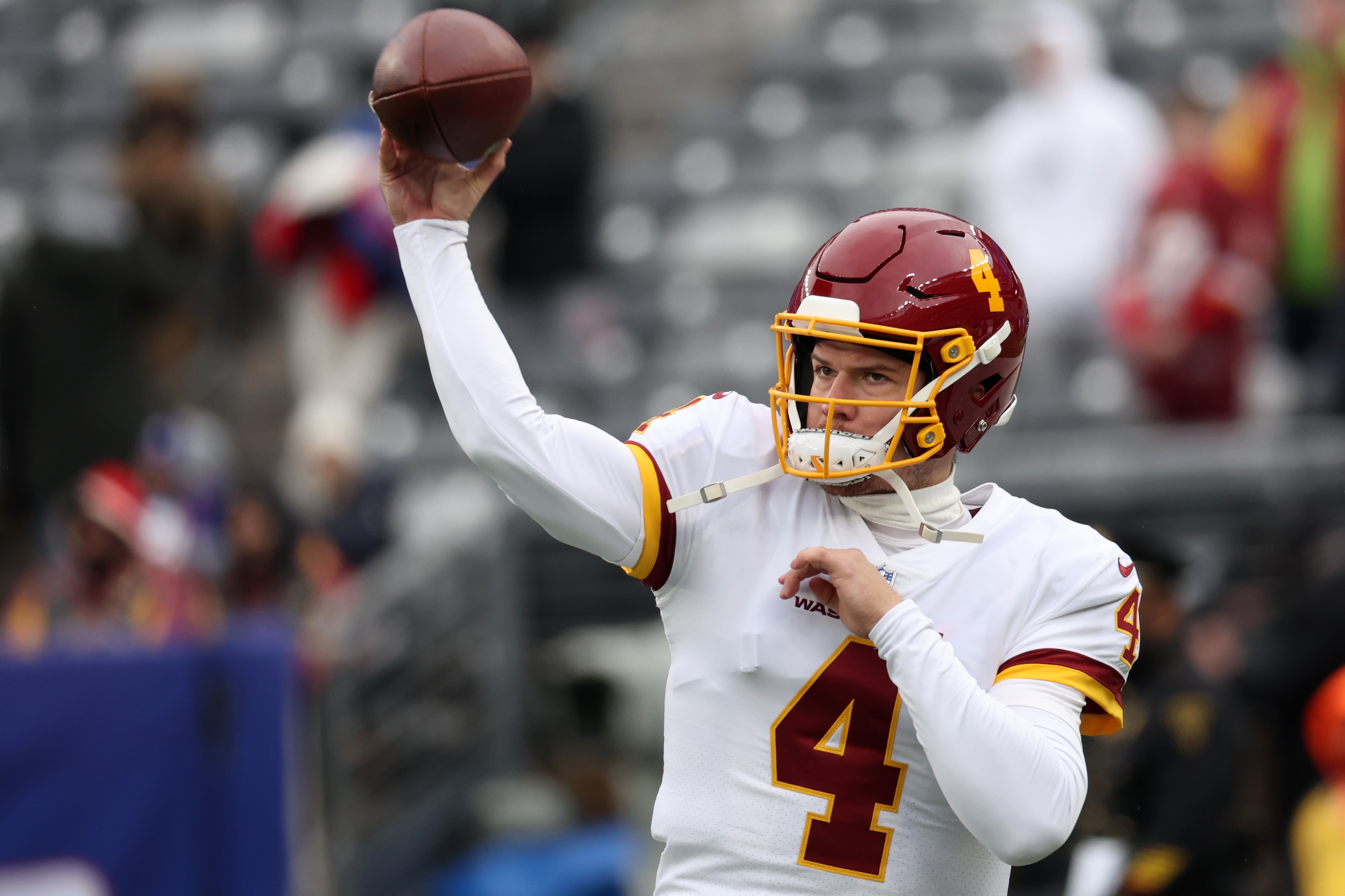 EAST RUTHERFORD, NEW JERSEY - JANUARY 09: Taylor Heinicke #4 of the Washington Football Team warms up before the game against the New York Giants at MetLife Stadium on January 09, 2022 in East Rutherford, New Jersey. (Photo by Dustin Satloff/Getty Images)