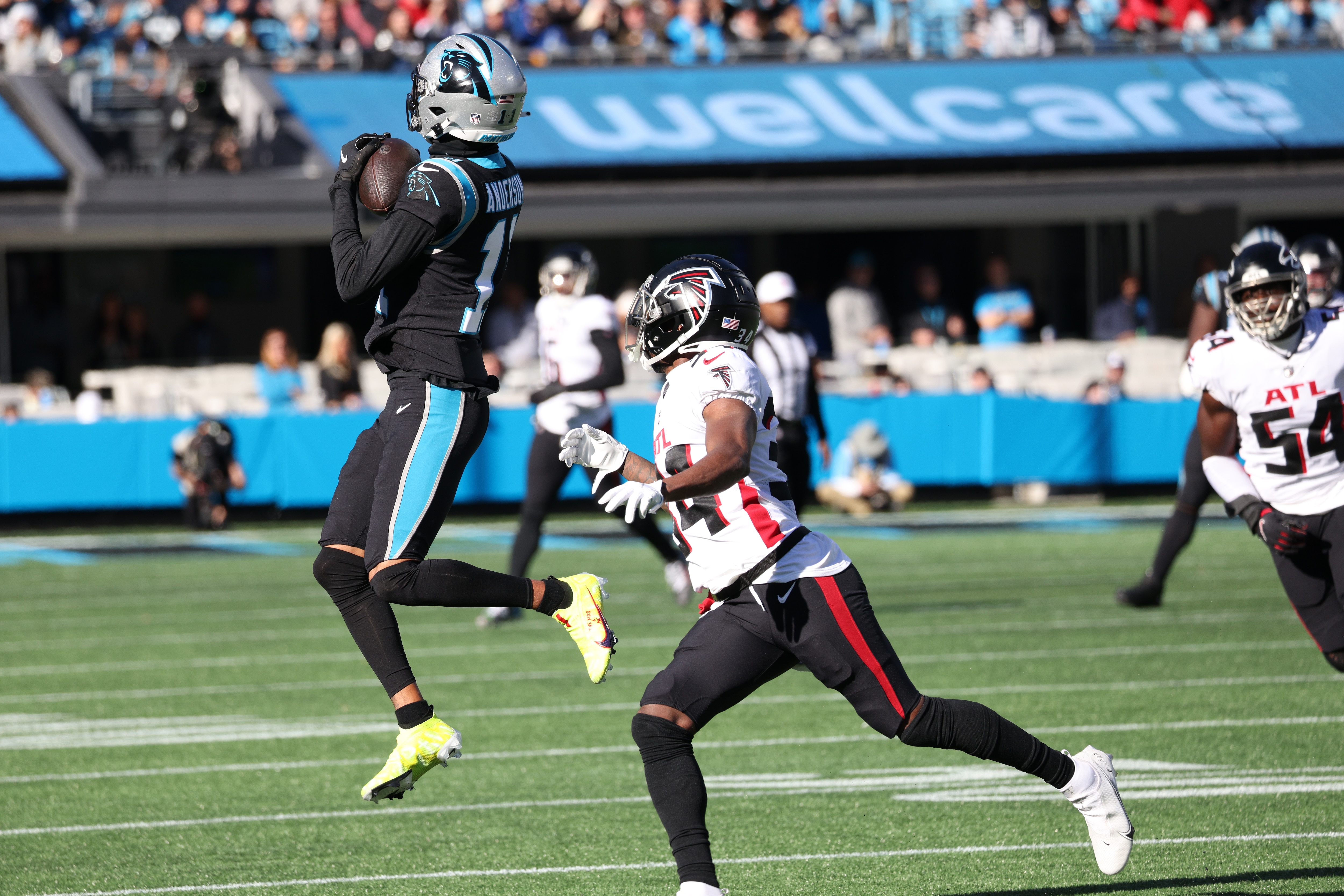CHARLOTTE, NC - DECEMBER 12: Robby Anderson #11 of the Carolina Panthers makes a catch against Darren Hall #34 of the Atlanta Falcons at Bank of America Stadium on December 12, 2021 in Charlotte, North Carolina. The Falcons won 29-21. (Photo by Lance King/Getty Images)