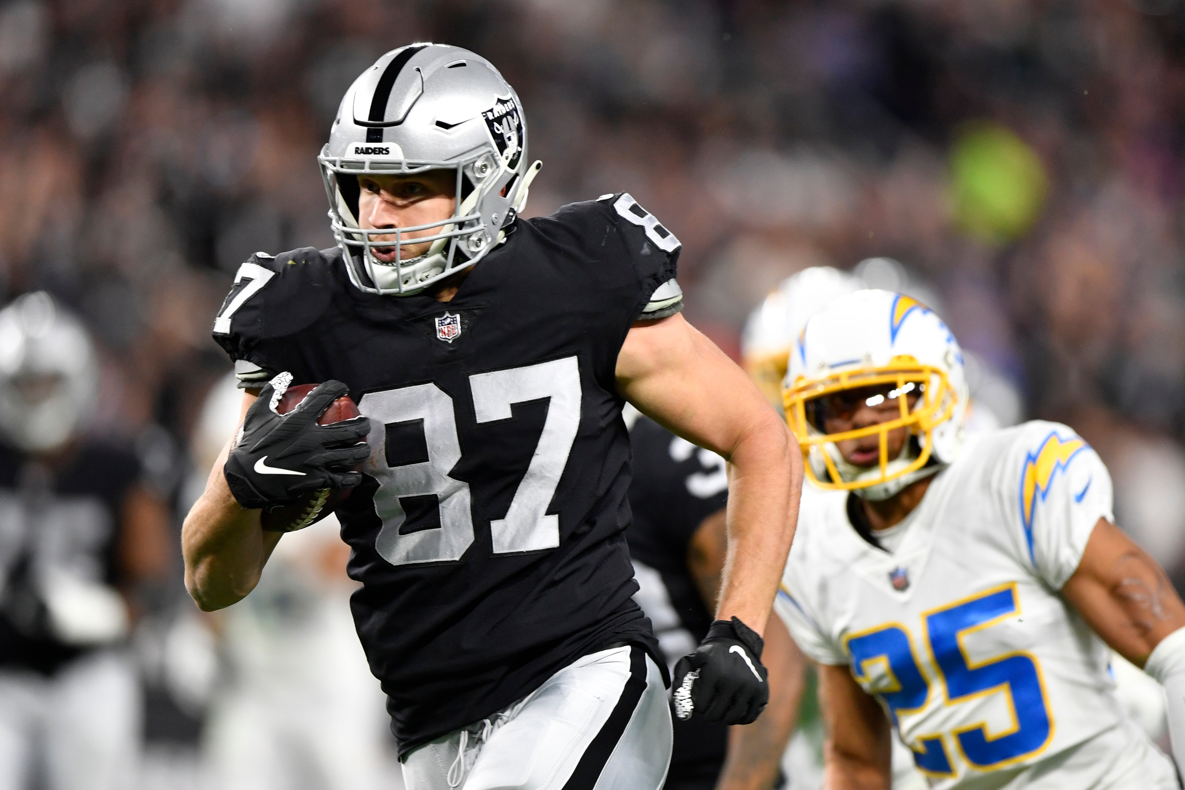 LAS VEGAS, NEVADA - JANUARY 09:  Tight end Foster Moreau #87 of the Las Vegas Raiders runs against the Los Angeles Chargers during the first half of a game at Allegiant Stadium on January 09, 2022 in Las Vegas, Nevada. The Raiders defeated the Chargers 35-32 in overtime. (Photo by Chris Unger/Getty Images)