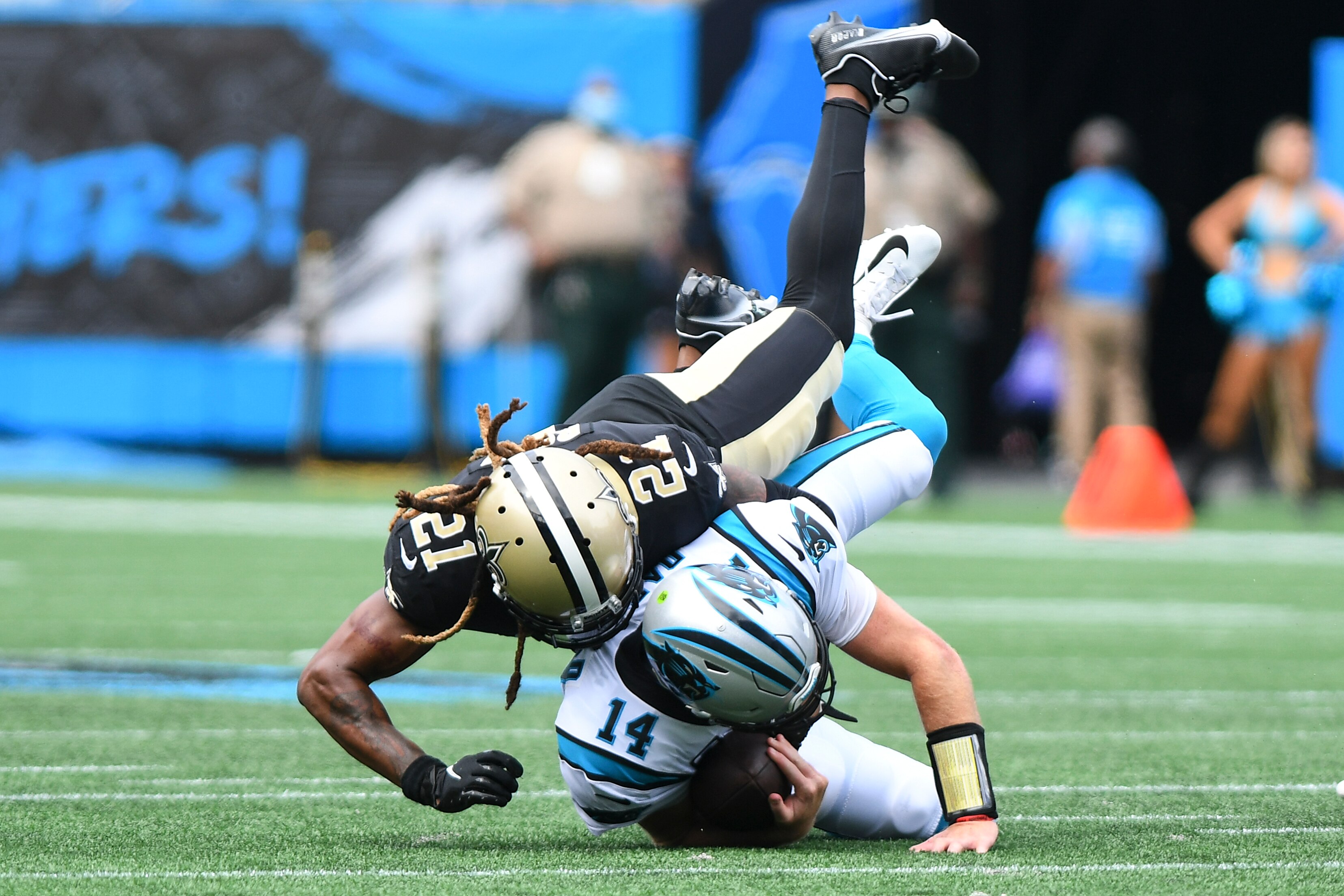 CHARLOTTE, NC - SEPTEMBER 19: New Orleans Saints Bradley Roby (21) sacks Carolina Panthers quarterback Sam Darnold (14) in the game between the New Orleans Saints and the Carolina Panthers on September 19, 2021 at Bank of America Stadium in Charlotte, NC. (Photo by Dannie Walls/Icon Sportswire via Getty Images)