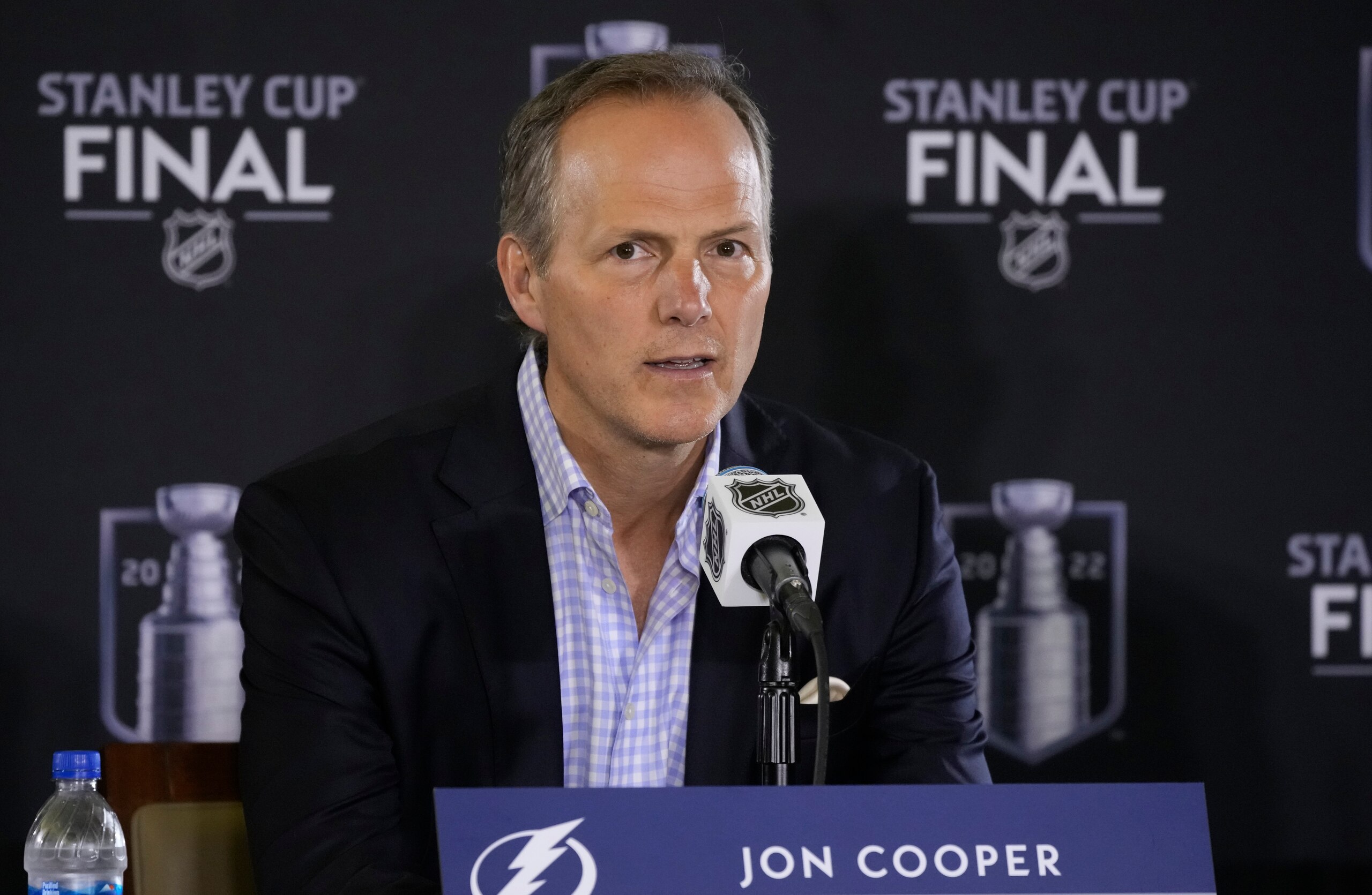 Tampa Bay Lightning head coach Jon Cooper speaks during an NHL hockey media day before Game 1 of the Stanley Cup Finals Tuesday, June 14, 2022, in Denver. (AP Photo/David Zalubowski)