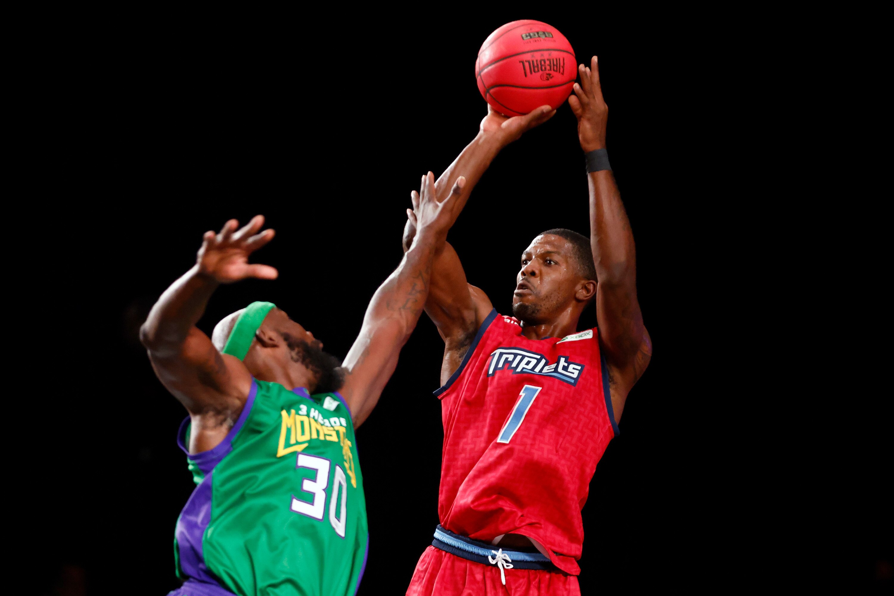 NASSAU, BAHAMAS - AUGUST 28: Joe Johnson #1 of the Triplets attempts a shot while being guarded by Reggie Evans #30 of the 3 Headed Monsters during the BIG3 - Playoffs at Atlantis Paradise Island on August 28, 2021 in Nassau, Bahamas. (Photo by Michael Reaves/Getty Images)