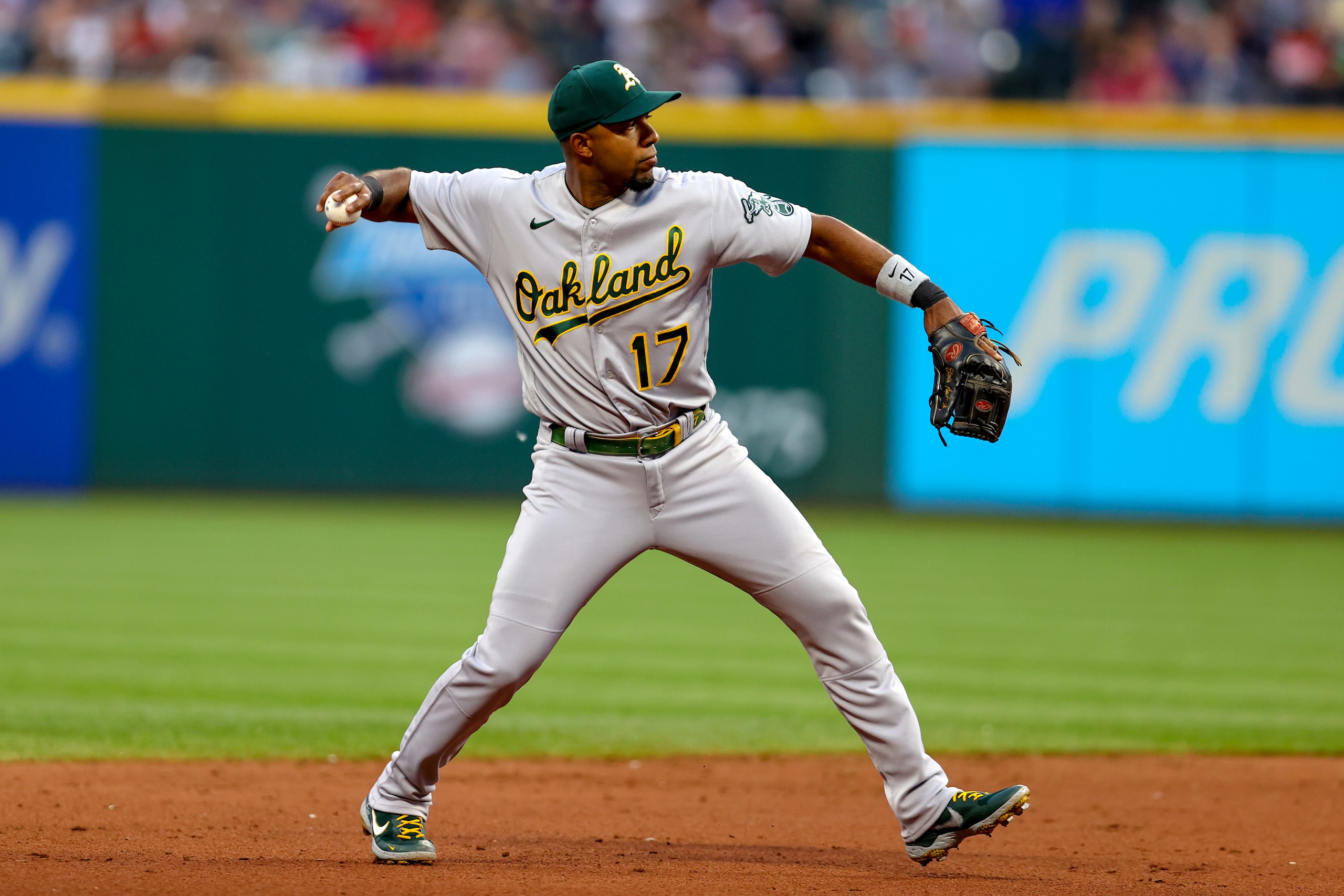 CLEVELAND, OH - JUNE 10: Oakland Athletics shortstop Elvis Andrus (17) throws to first base for an out during the fifth inning of the Major League Baseball game between the Oakland Athletics and Cleveland Guardians on June 10, 2022, at Progressive Field in Cleveland, OH.  (Photo by Frank Jansky/Icon Sportswire via Getty Images)