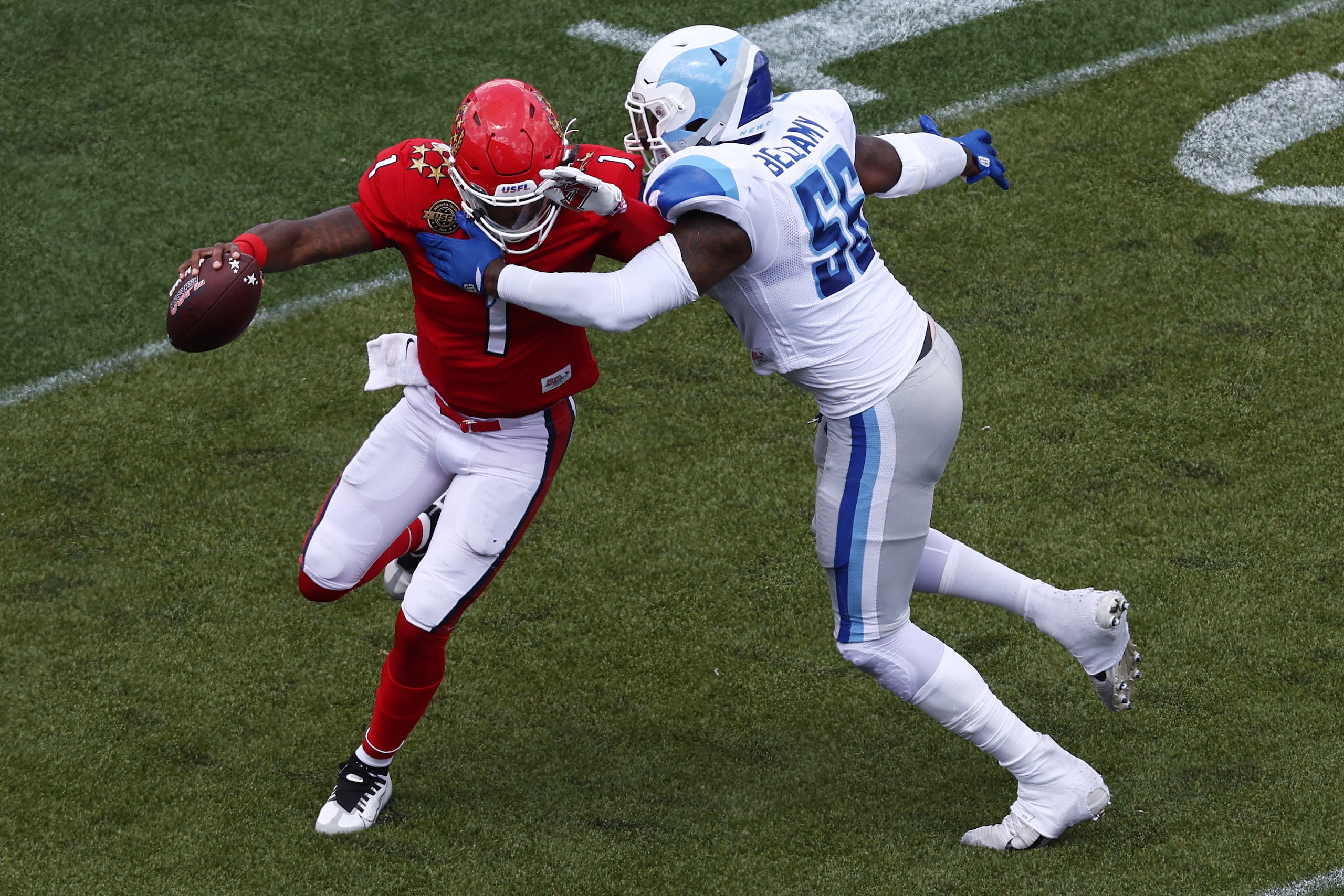 BIRMINGHAM, ALABAMA - MAY 14: De'Andre Johnson #1 of New Jersey Generals runs with the ball as Davin Bellamy #56 of New Orleans Breakers defends in the first quarter of the game at Protective Stadium on May 14, 2022 in Birmingham, Alabama. (Photo by Tom Pennington/USFL/Getty Images) BIRMINGHAM, ALABAMA - MAY 14: De'Andre Johnson #1 of New Jersey Generals runs with the ball as Davin Bellamy #56 of New Orleans Breakers defends in the first quarter of the game at Protective Stadium on May 14, 2022 in Birmingham, Alabama. (Photo by Tom Pennington/USFL/Getty Images)