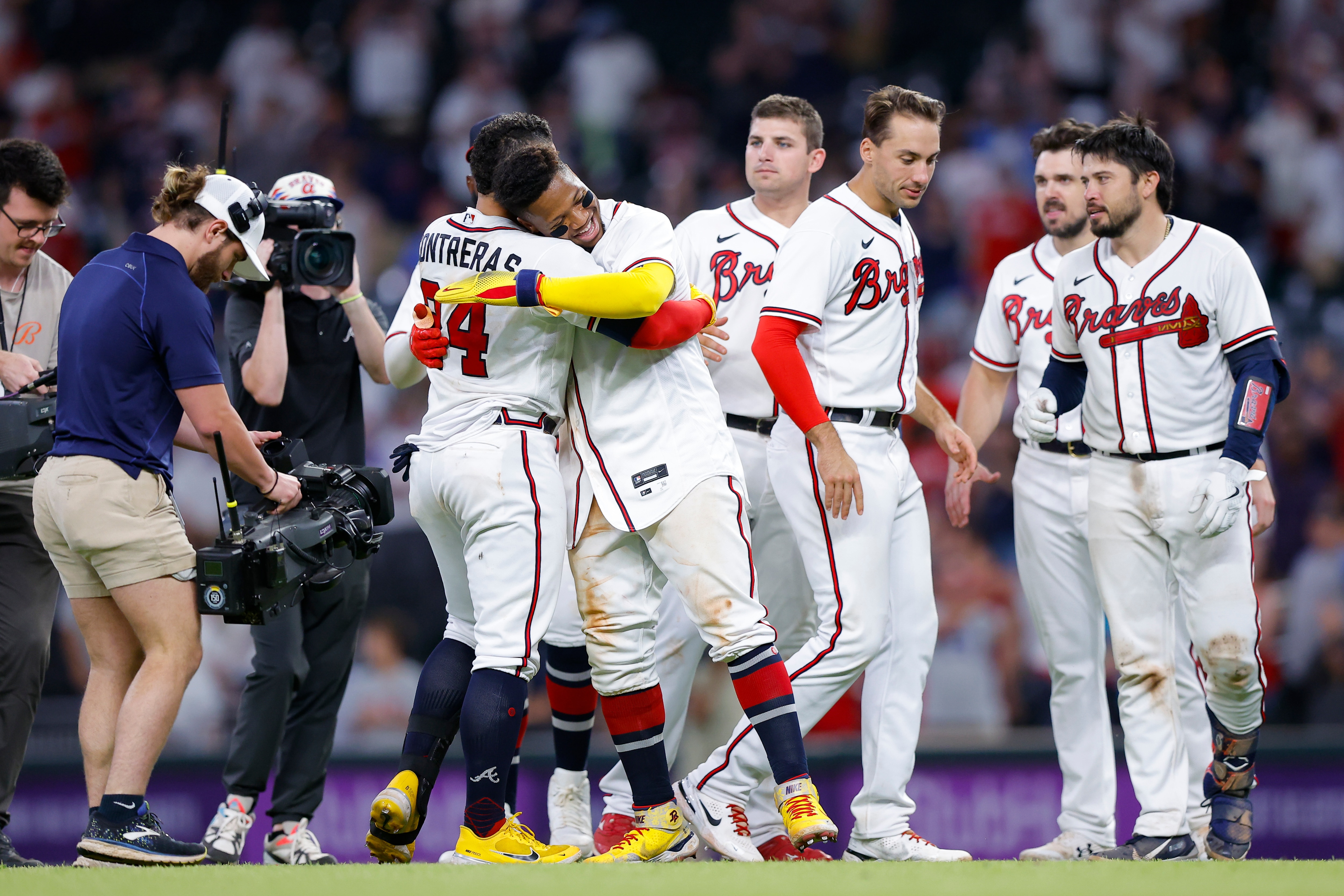 Atlanta Braves William Contreras (24) reacts with Ronald Acuna Jr. after his game winning single in the ninth inning of a baseball game against the Philadelphia Phillies, Tuesday, May 24, 2022, in Atlanta. (AP Photo/Todd Kirkland)