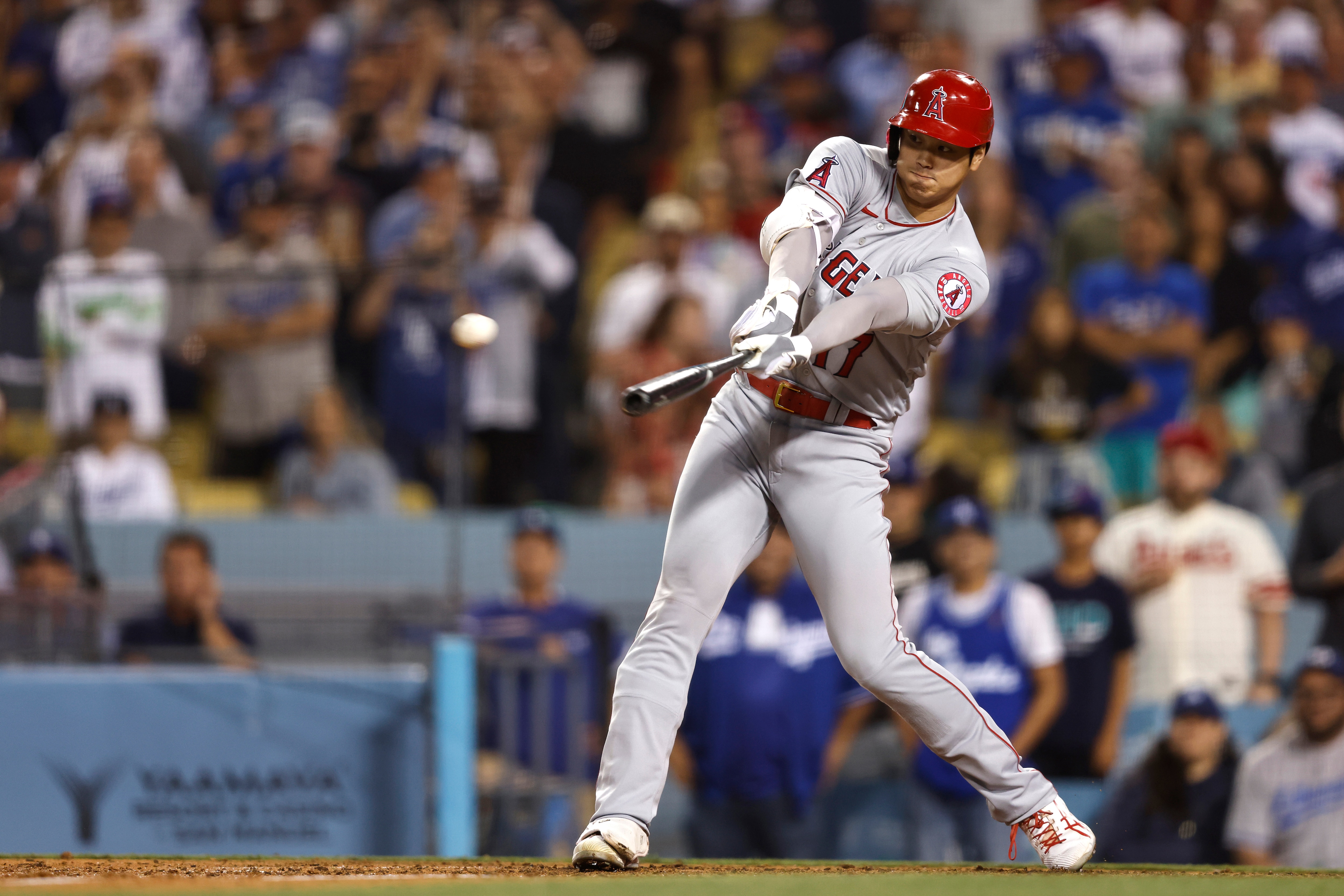 LOS ANGELES, CALIFORNIA - JUNE 15: Shohei Ohtani #17 of the Los Angeles Angels hits a triple against the Los Angeles Dodgers during the ninth inning at Dodger Stadium on June 15, 2022 in Los Angeles, California. The Dodgers won 4-1. (Photo by Michael Owens/Getty Images)