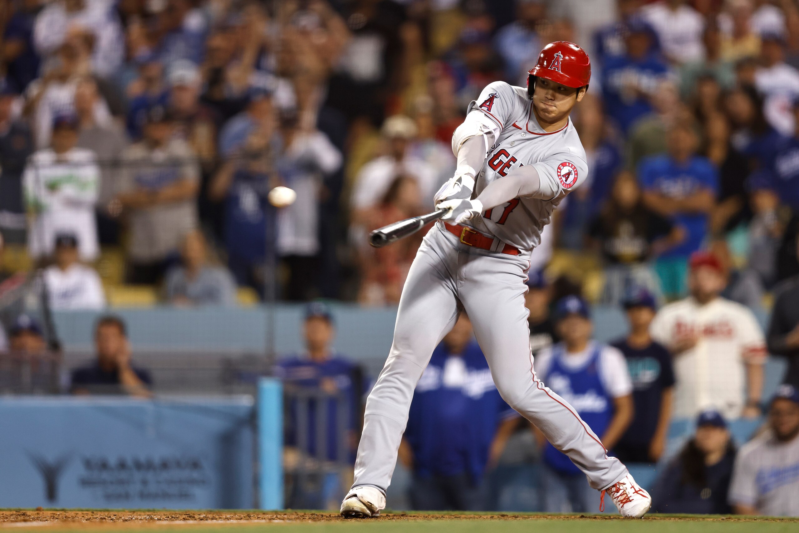 LOS ANGELES, CALIFORNIA - JUNE 15: Shohei Ohtani #17 of the Los Angeles Angels hits a triple against the Los Angeles Dodgers during the ninth inning at Dodger Stadium on June 15, 2022 in Los Angeles, California. The Dodgers won 4-1. (Photo by Michael Owens/Getty Images)