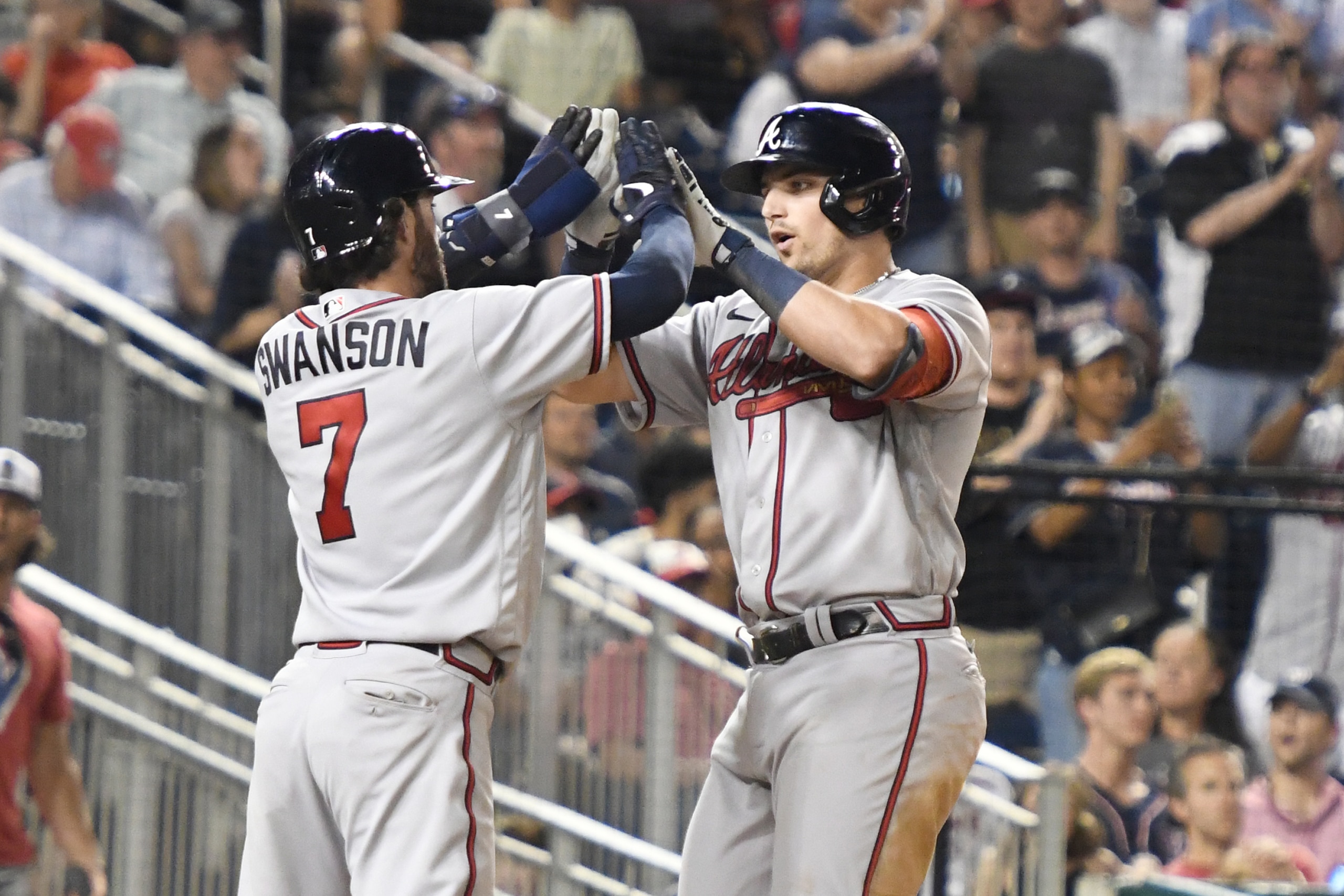 WASHINGTON, DC - JUNE 15:  Austin Riley #27 of the Atlanta Braves celebrates a two run home run with Dansby Swanson #7 in the seventh inning during a baseball game against the Washington Nationals at Nationals Park on June 15, 2022 in Washington, DC.  (Photo by Mitchell Layton/Getty Images)