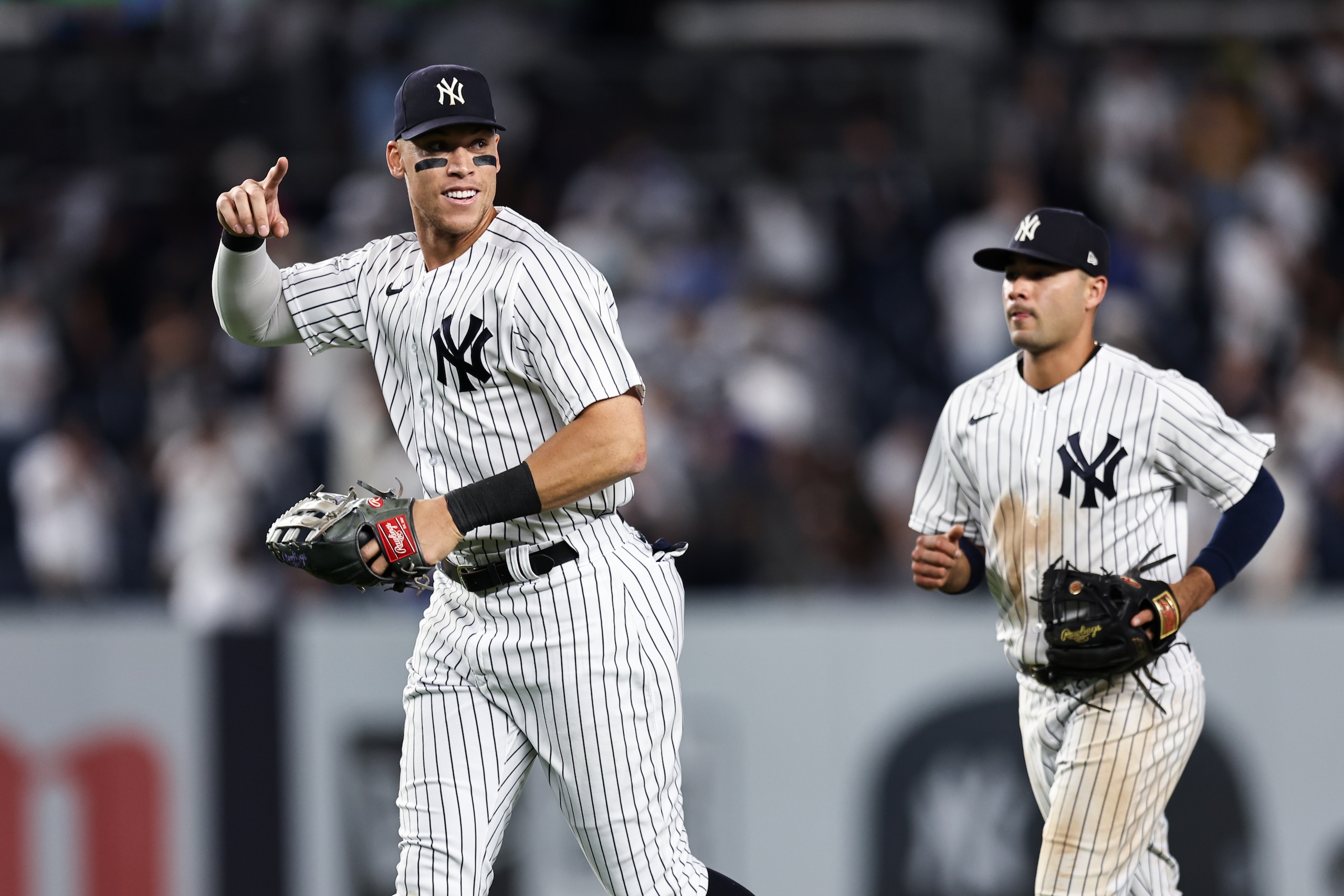 NEW YORK, NEW YORK - JUNE 14: Aaron Judge #99 of the New York Yankees points to a teammate as he celebrates a 2-0 victory in the game against the Tampa Bay Rays at Yankee Stadium on June 14, 2022 in New York City. (Photo by Dustin Satloff/Getty Images)