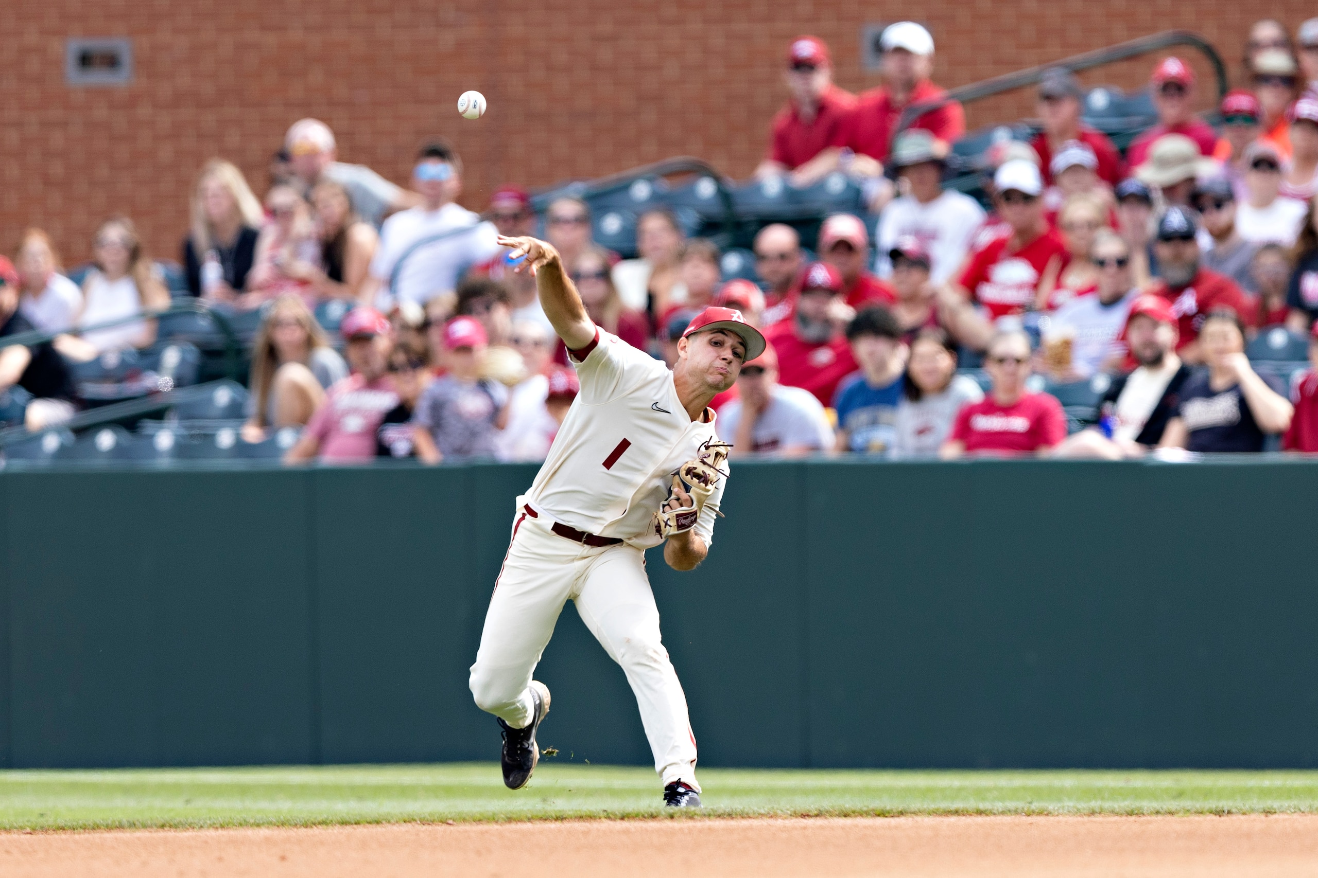 FAYETTEVILLE, ARKANSAS - MAY 15: Robert Moore #1 of the Arkansas Razorbacks attempts to third base during the third and final game of a series against the Vanderbilt Commodores at Baum-Walker Stadium at George Cole Field on May 15, 2022 in Fayetteville, Arkansas. The Commodores defeated the Razorbacks 5-0. (Photo by Wesley Hitt/Getty Images)