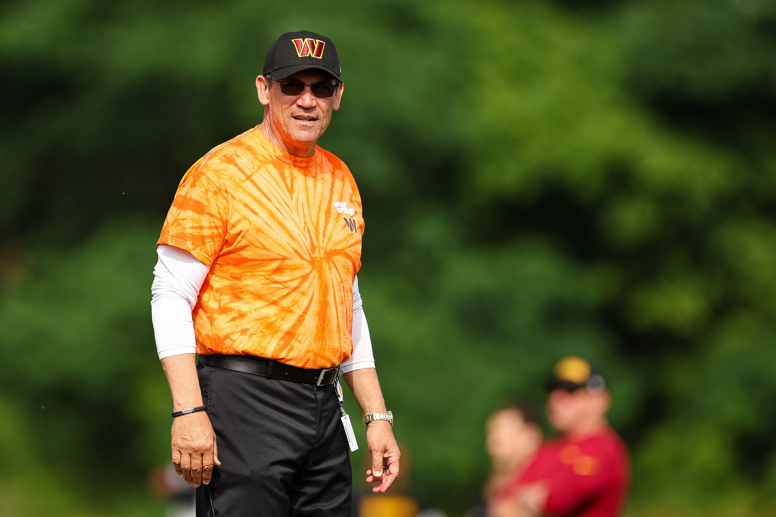 ASHBURN, VA - JUNE 16: Head coach Ron Rivera of the Washington Commanders looks on while wearing an orange shirt in support of ending gun violence during the organized team activity at INOVA Sports Performance Center on June 16, 2022 in Ashburn, Virginia. (Photo by Scott Taetsch/Getty Images)