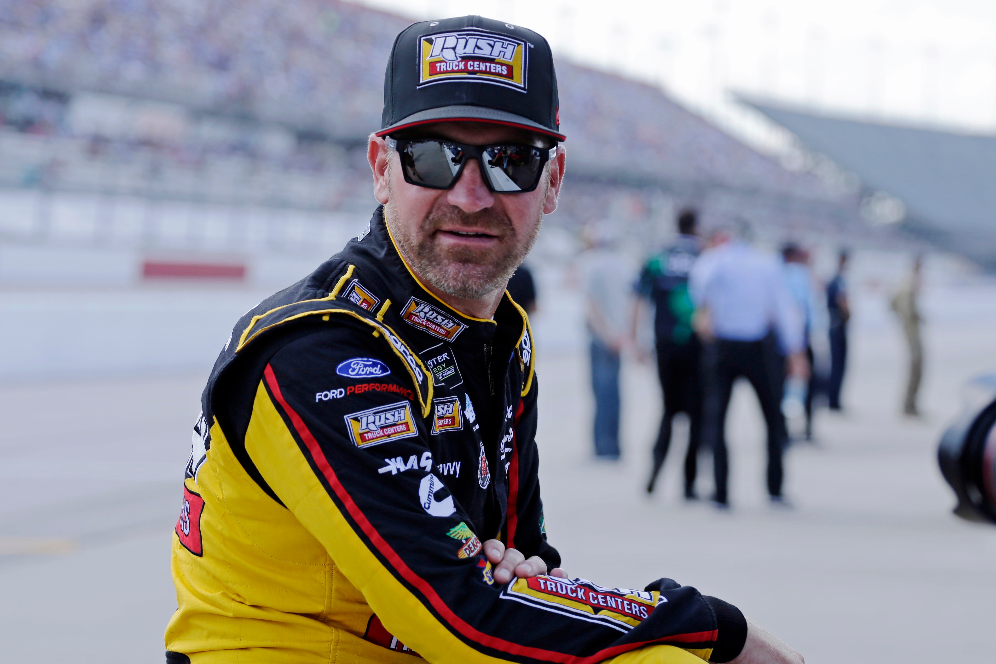 FILE - In this Aug. 31, 2019, file photo, Clint Bowyer waits on pit road for his turn to qualify for the NASCAR Cup Series auto race at Darlington Raceway in Darlington, S.C. wyer, popular among his peers and a beloved by fans, would have preferred a proper send-off in his final year as a NASCAR driver. Instead, he’ll settle for a farewell party Sunday at Kansas Speedway. Bowyer is retiring from racing at the end of this season and move into the Fox Sports booth. (AP Photo/Terry Renna, File)