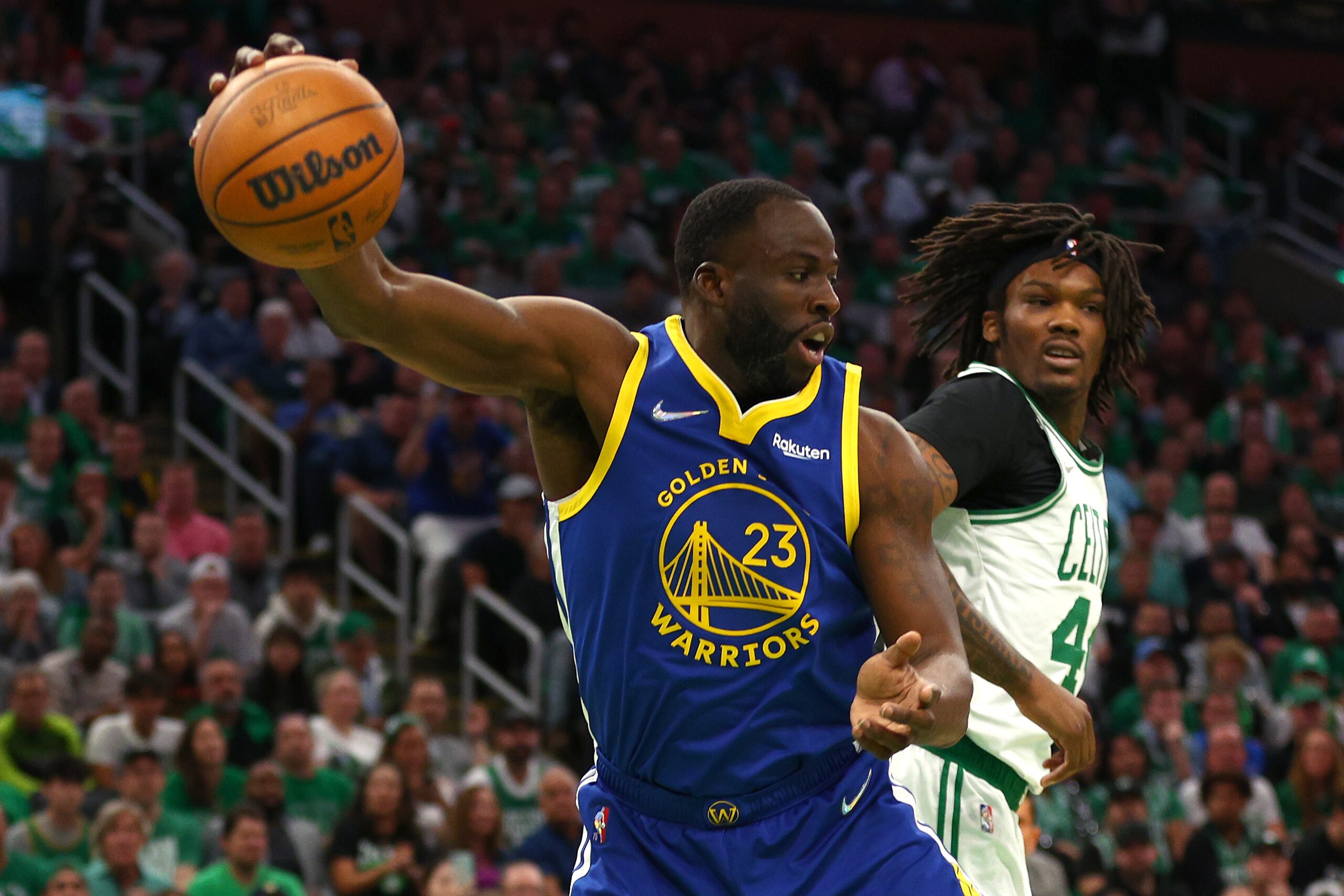 BOSTON, MASSACHUSETTS - JUNE 16: Draymond Green #23 of the Golden State Warriors grabs a rebound from Robert Williams III #44 of the Boston Celtics during the first quarter in Game Six of the 2022 NBA Finals at TD Garden on June 16, 2022 in Boston, Massachusetts. NOTE TO USER: User expressly acknowledges and agrees that, by downloading and/or using this photograph, User is consenting to the terms and conditions of the Getty Images License Agreement. (Photo by Elsa/Getty Images)