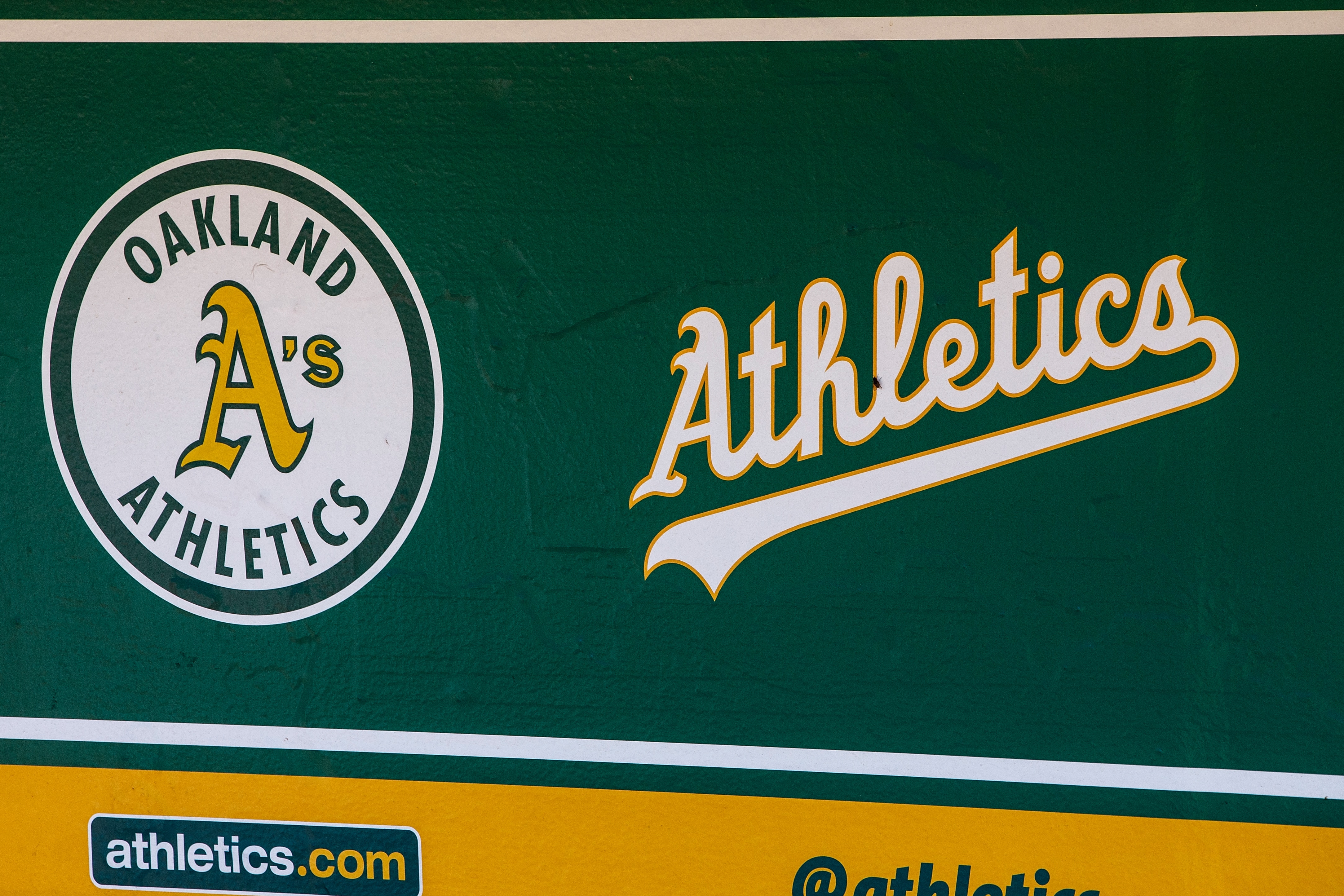 OAKLAND, CA - JULY 22:  General view of the Oakland Athletics logos in the dugout before the game against the San Francisco Giants at the Oakland Coliseum on July 22, 2018 in Oakland, California. The Oakland Athletics defeated the San Francisco Giants 6-5 in 10 innings. (Photo by Jason O. Watson/Getty Images)