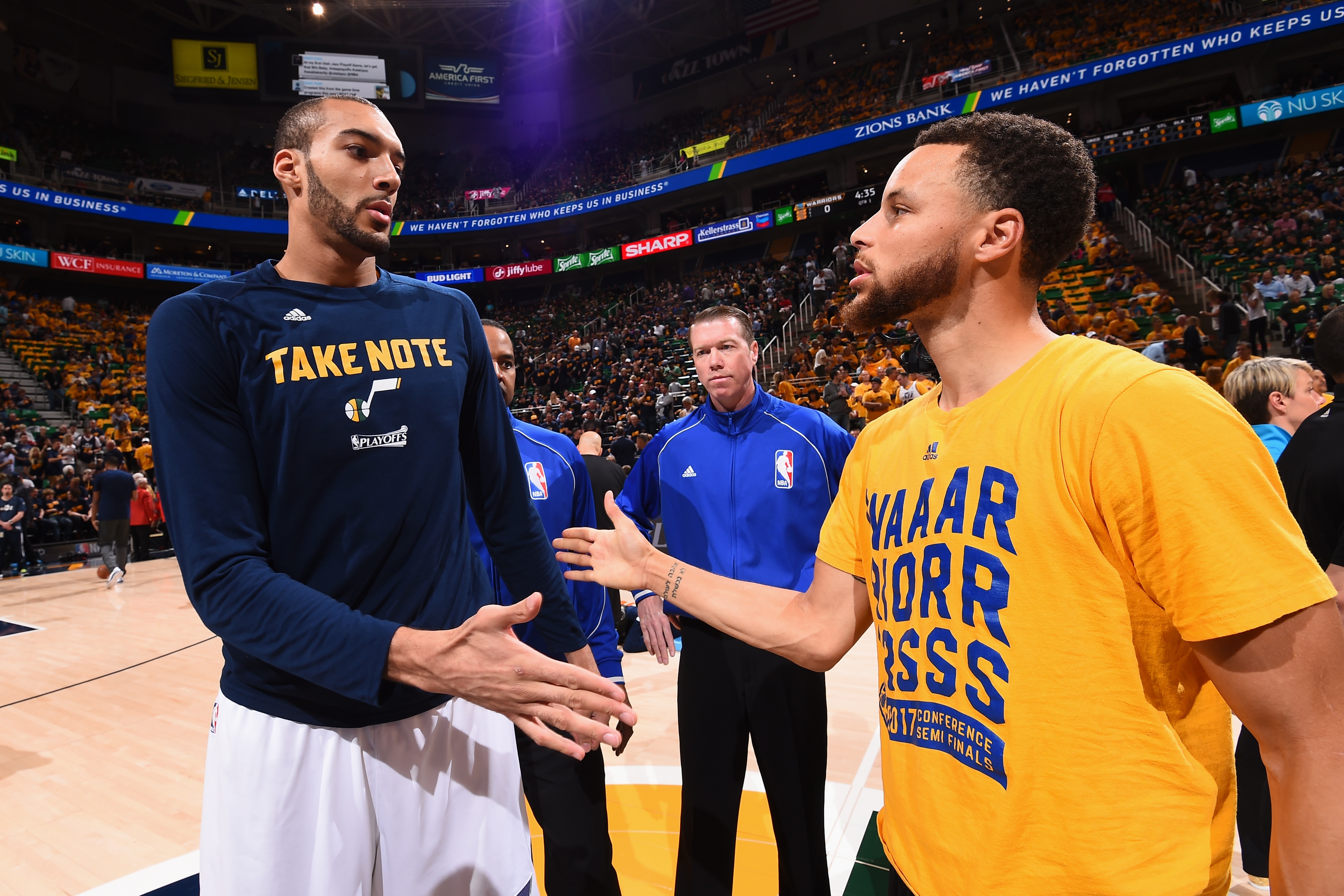 SALT LAKE CITY, UT - MAY 6:  Stephen Curry #30 of the Golden State Warriors and Rudy Gobert #27 of the Utah Jazz high five before the game during Game Three of the Western Conference Semifinals of the 2017 NBA Playoffs on May 6, 2017 at vivint.SmartHome Arena in Salt Lake City, Utah. NOTE TO USER: User expressly acknowledges and agrees that, by downloading and/or using this Photograph, user is consenting to the terms and conditions of the Getty Images License Agreement. Mandatory Copyright Notice: Copyright 2017 NBAE (Photo by Andrew D. Bernstein/NBAE via Getty Images)